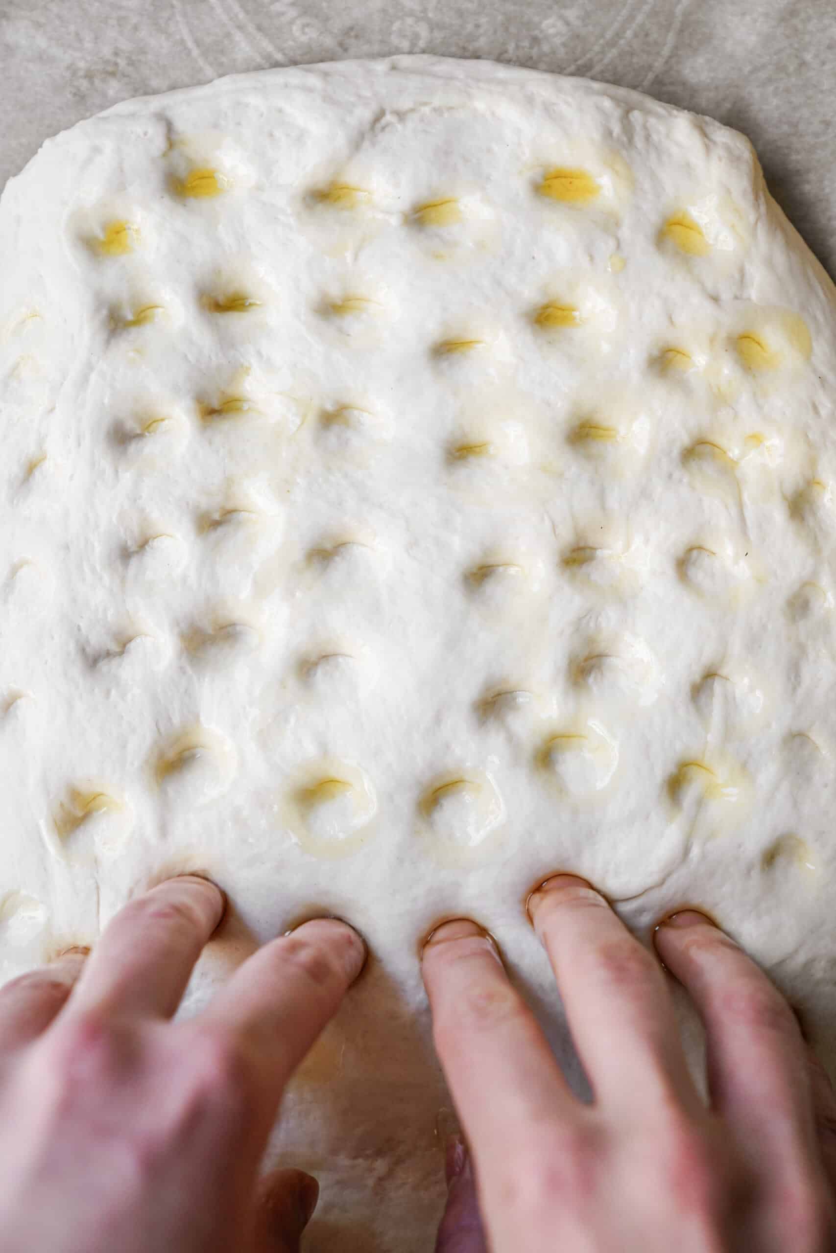 Finger prints in dough for Focaccia Bread Recipe