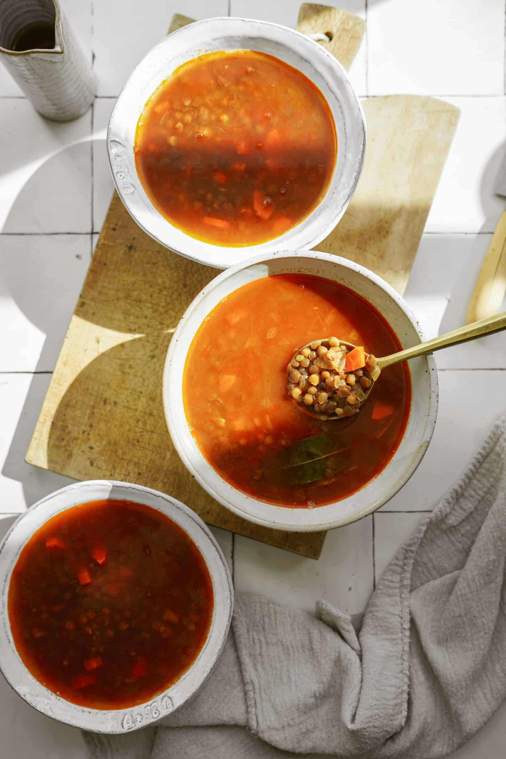 Greek lentil soup (fakes) in white bowls