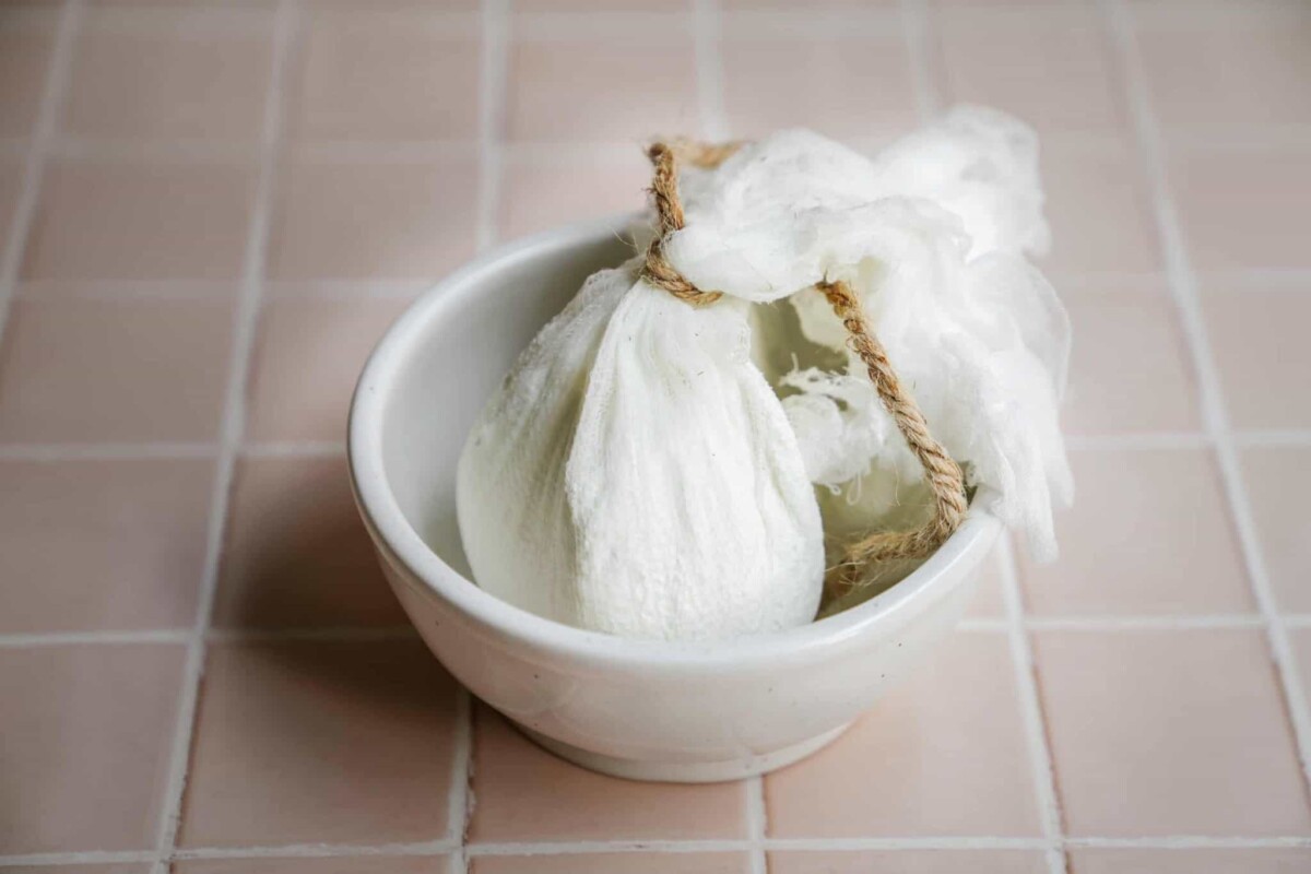 Labneh in a cheese cloth in a bowl
