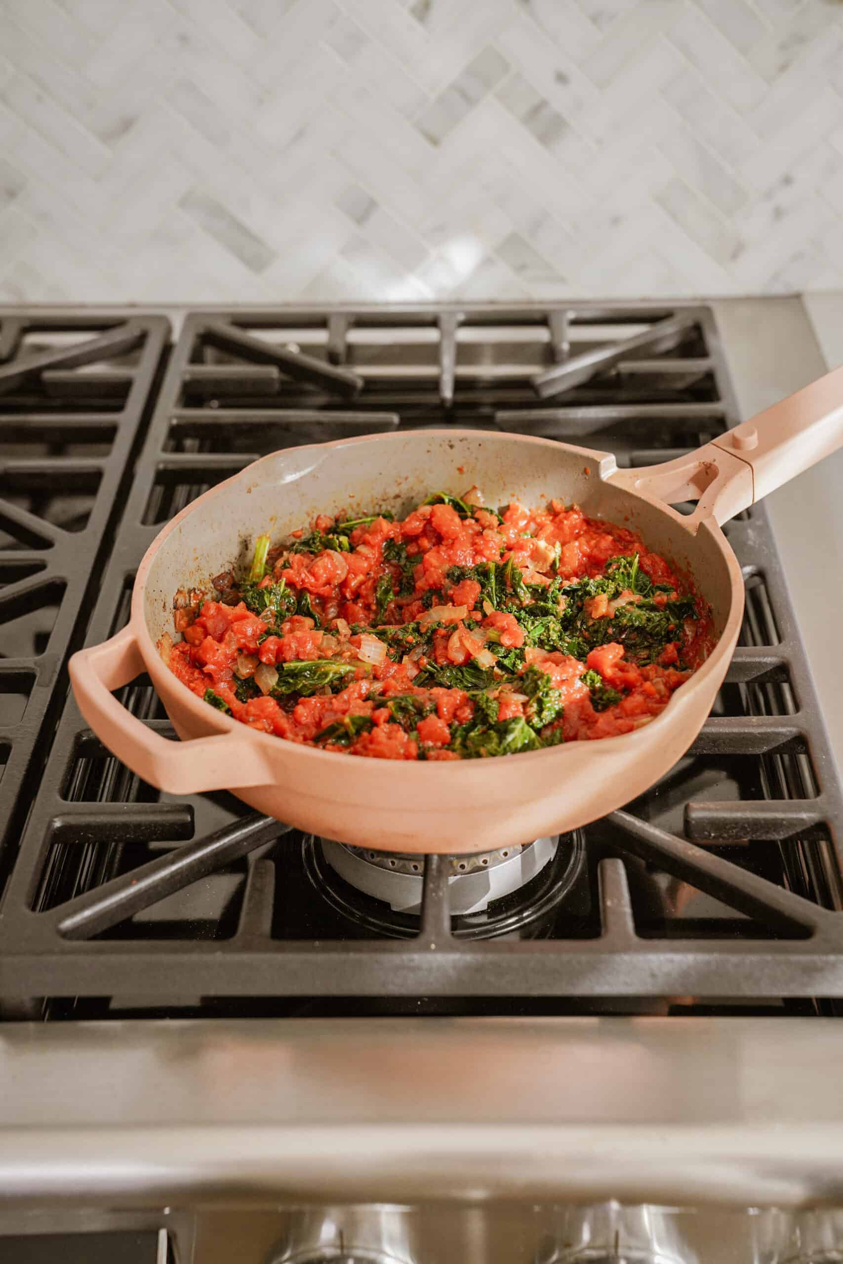 Ingredients in a pan for pesto pasta bake