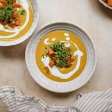 Pumpkin soup recipe in white bowls