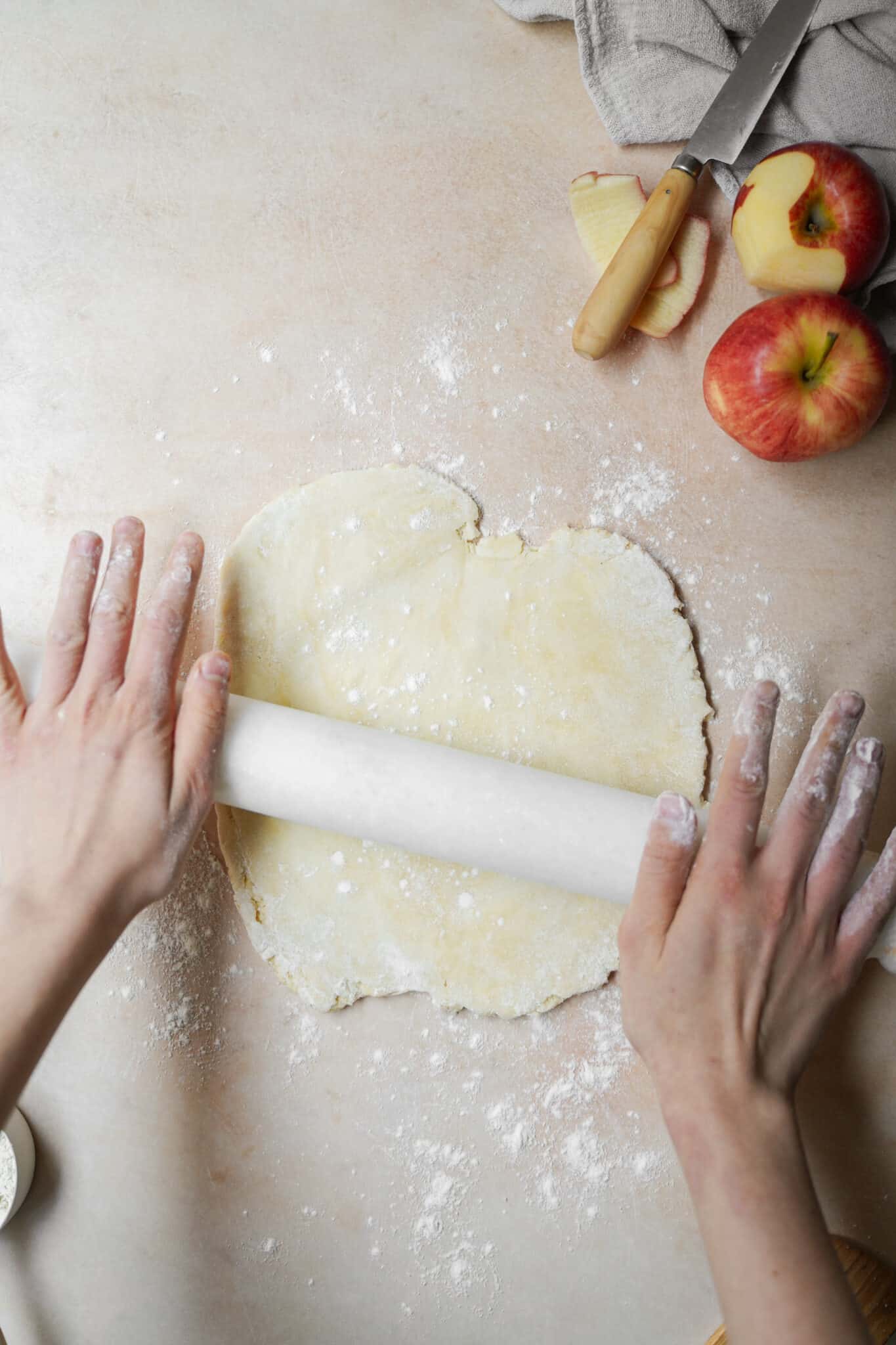 Dough being rolled out on counter