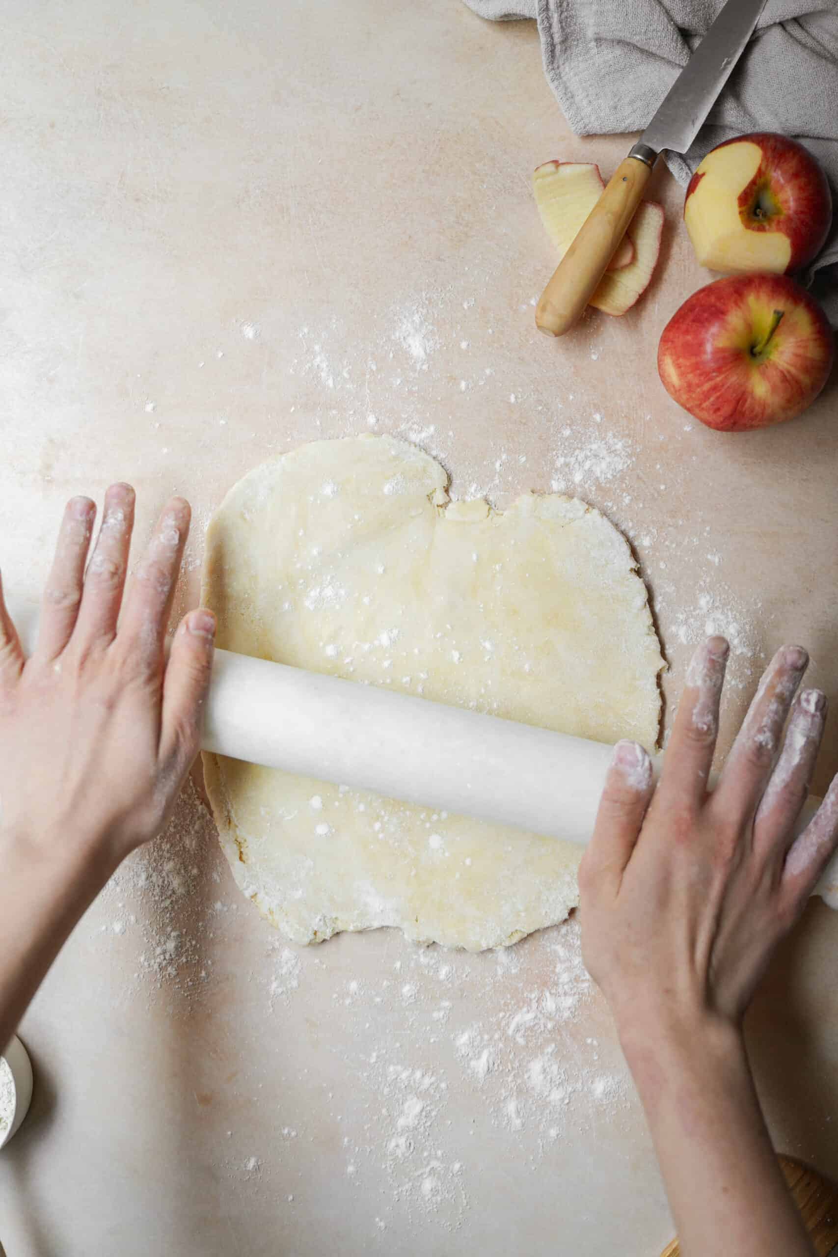 Dough being rolled out on counter