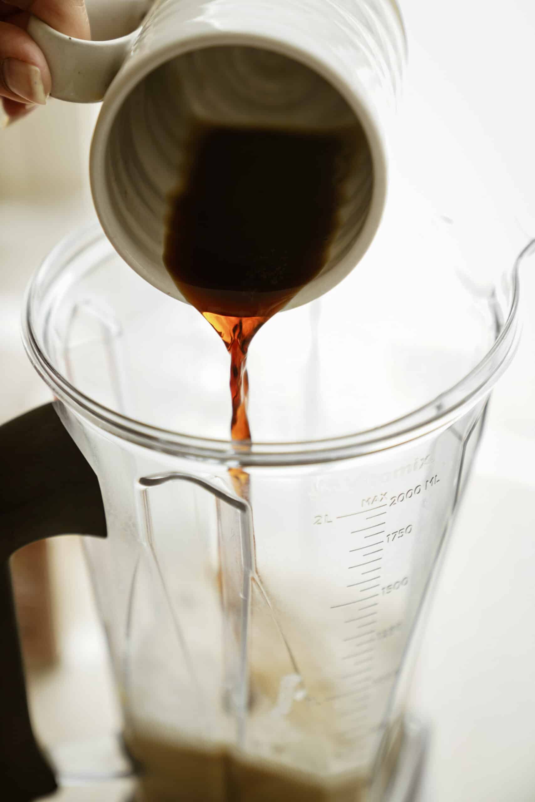 Espresso being poured in blender for pumpkin spice latte