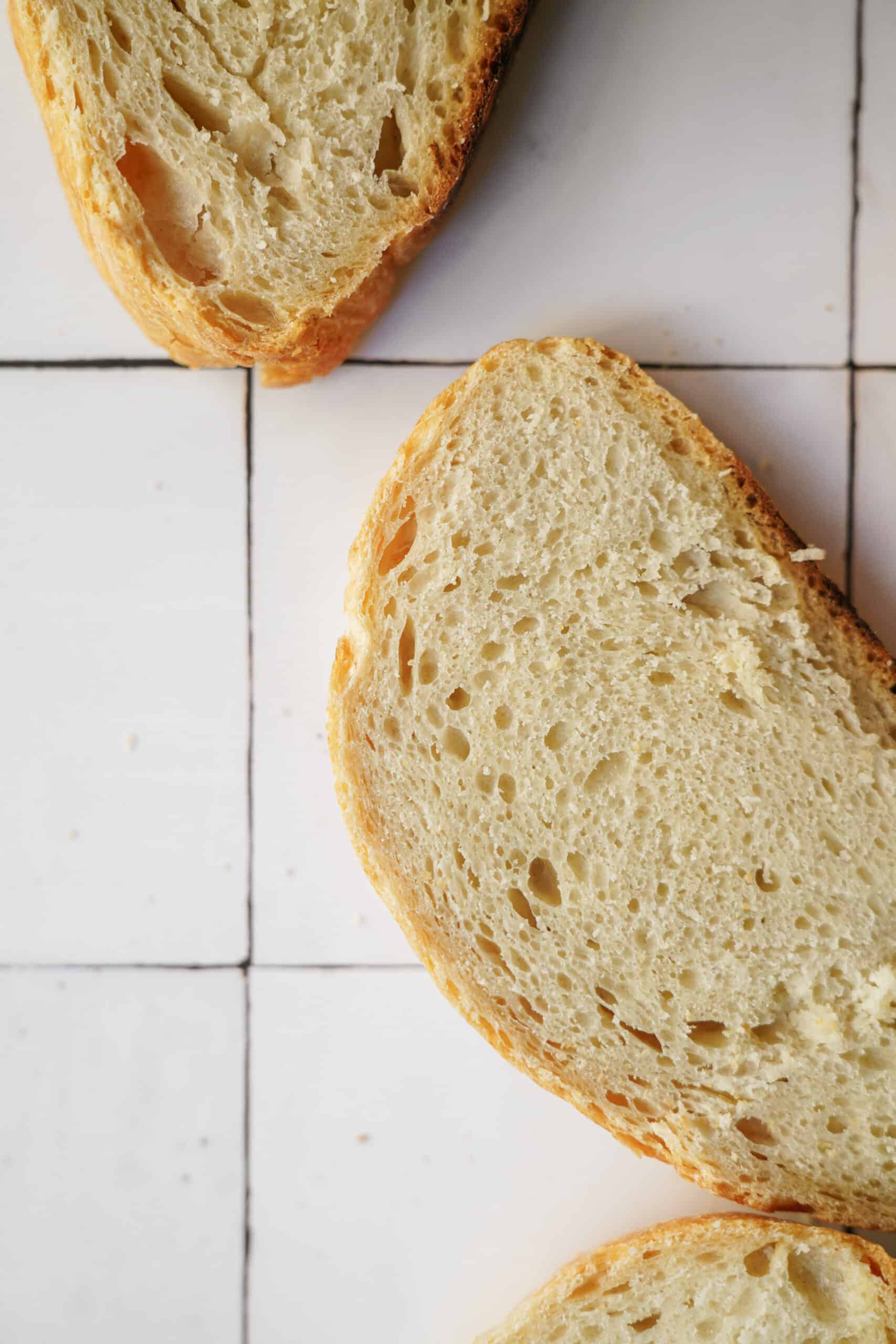 Slices of no-knead bread on counter