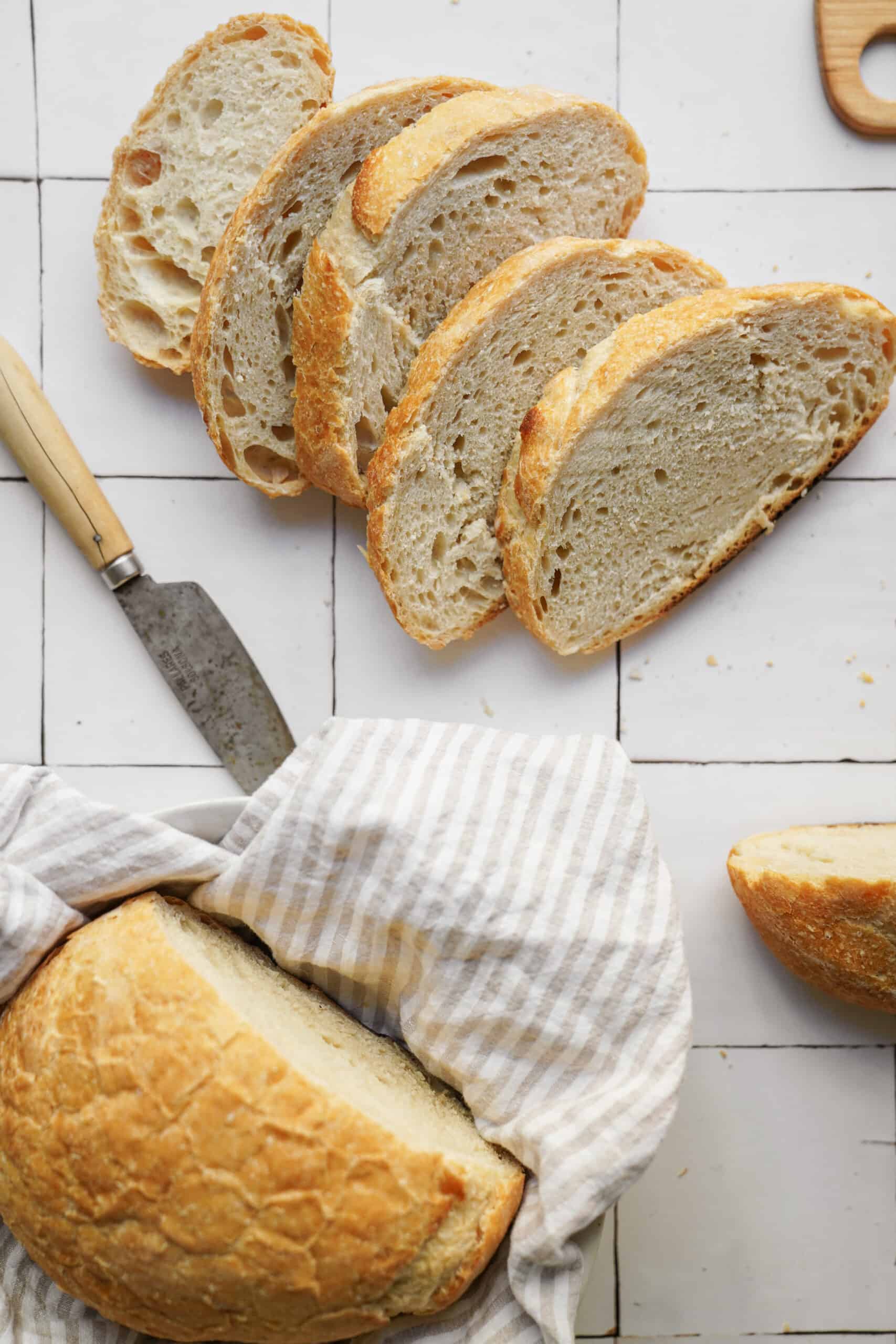 No-Knead Bread Recipe cut into slices on counter