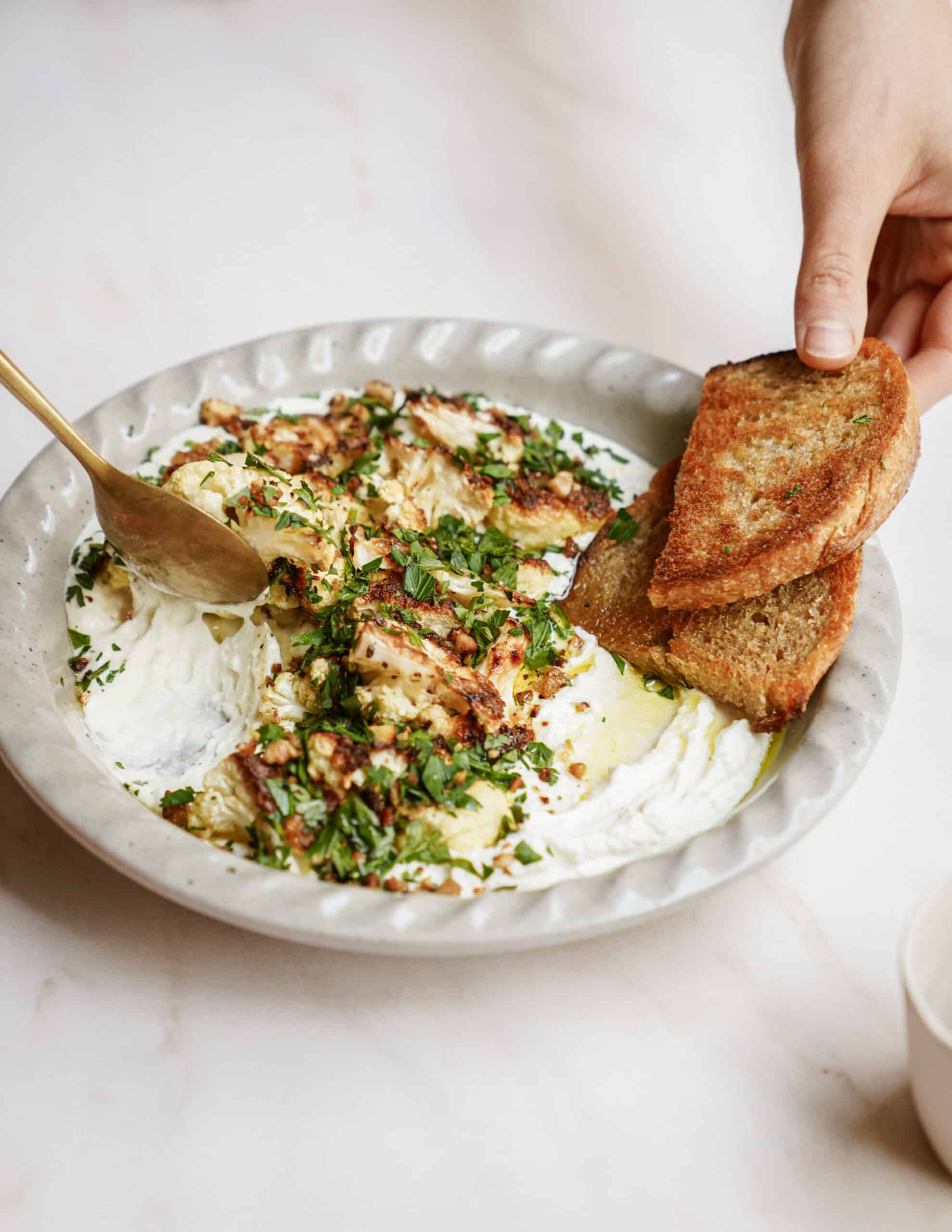 Whipped feta dip with pita chips on the side