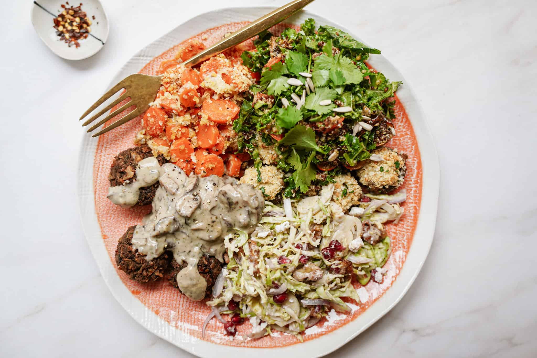 Baked carrots as a side to a complete dinner on a plate