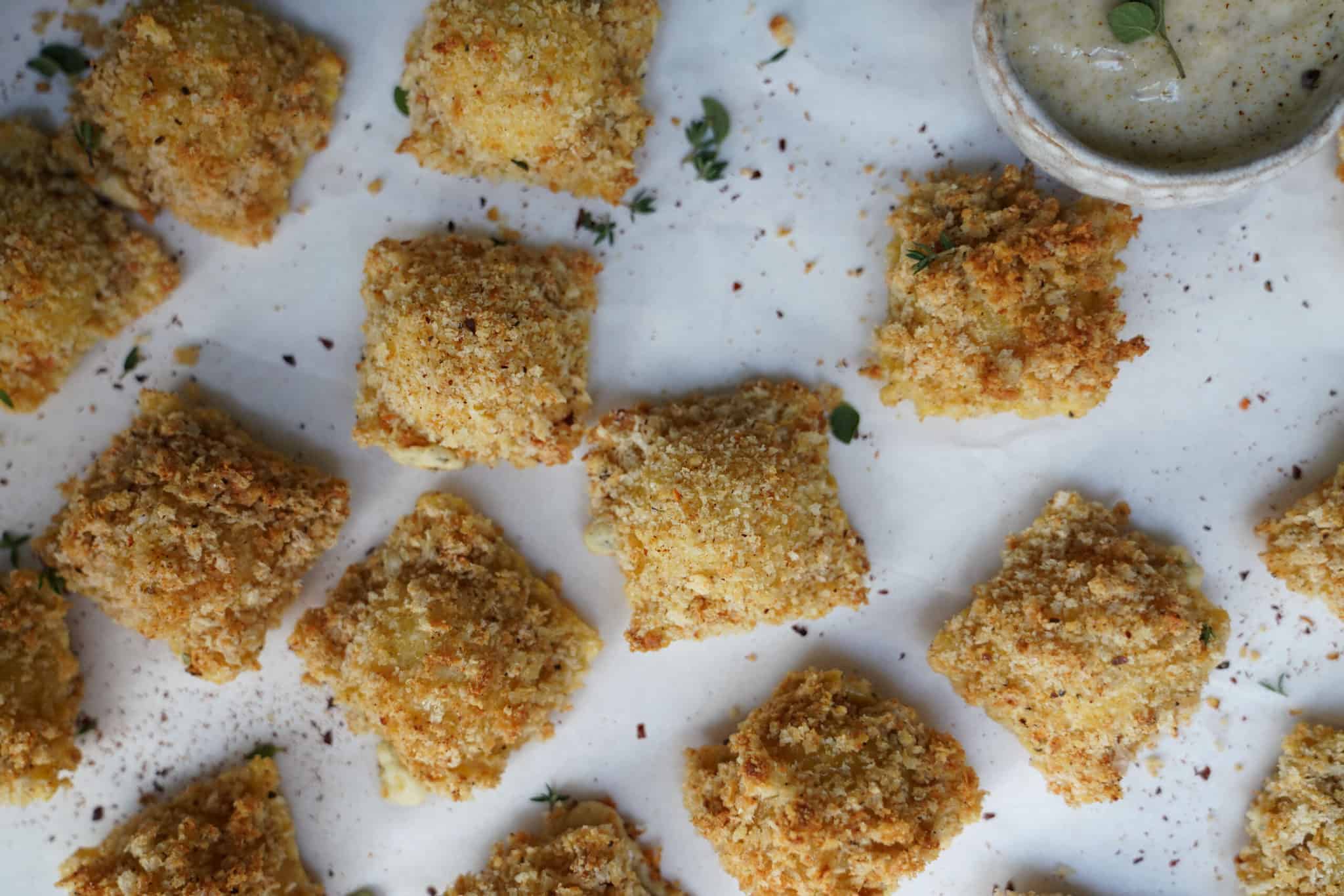 Baked ravioli scattered on a table