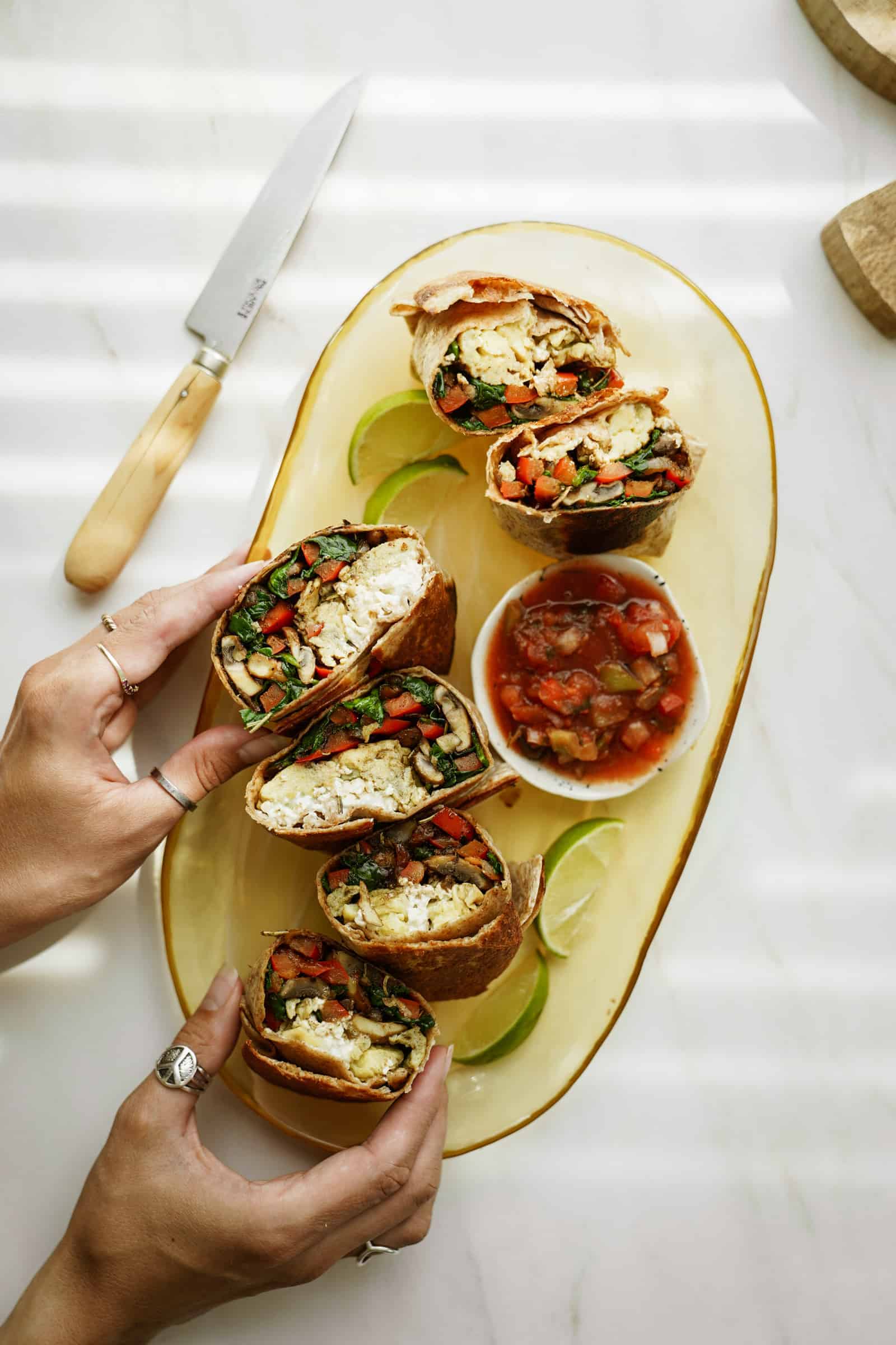 Vegetarian breakfast burritos on a serving tray