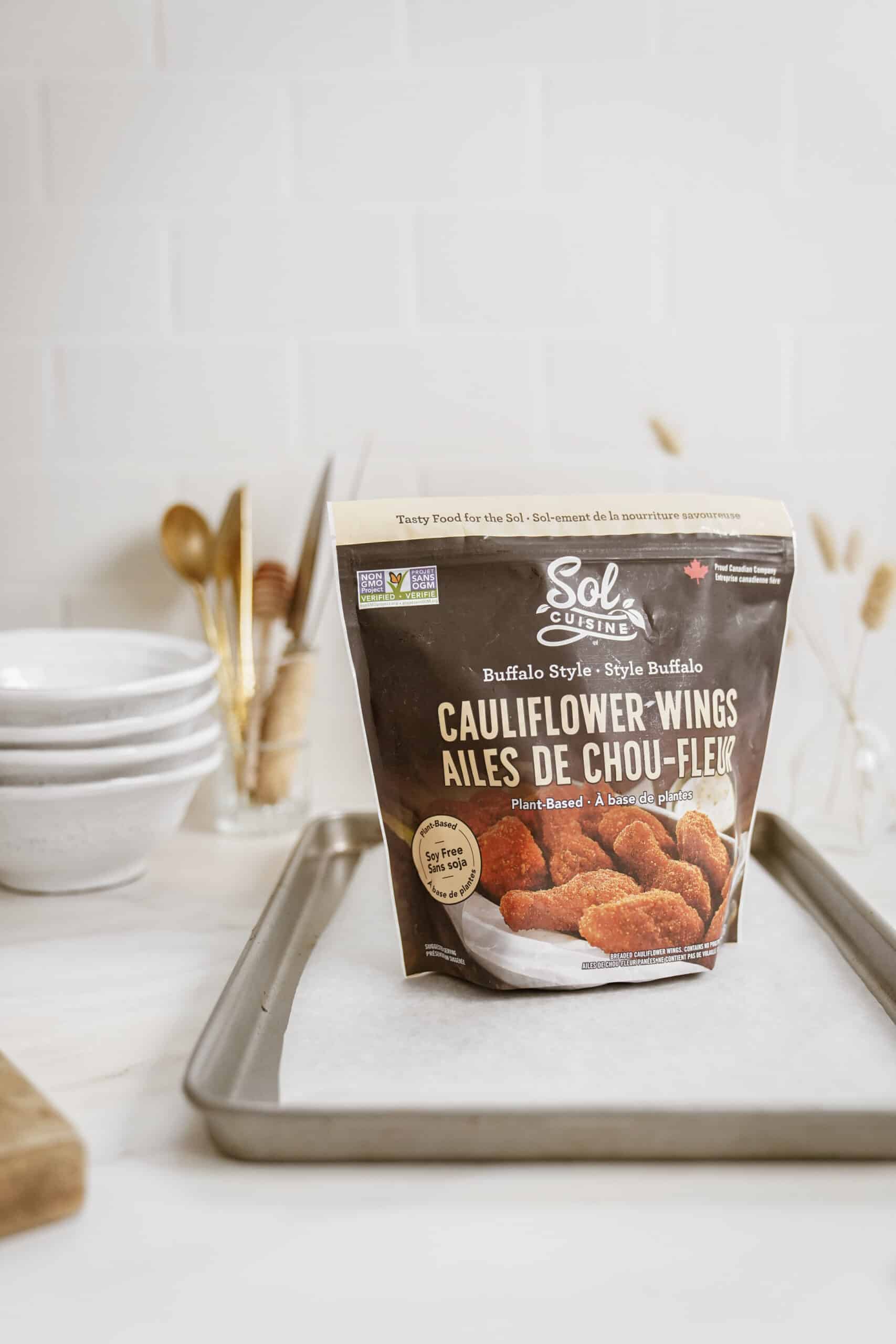 Cauliflower wings for buffalo chicken nachos on a baking sheet