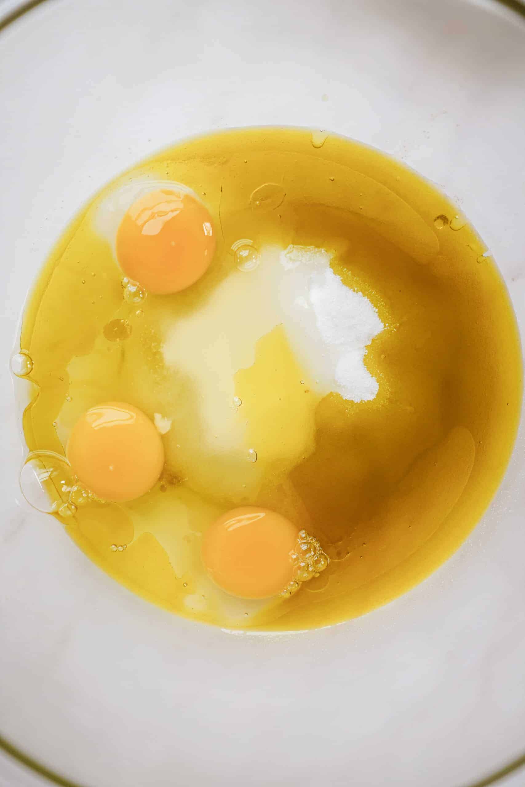 Wet ingredients for chocolate olive oil cake in a bowl