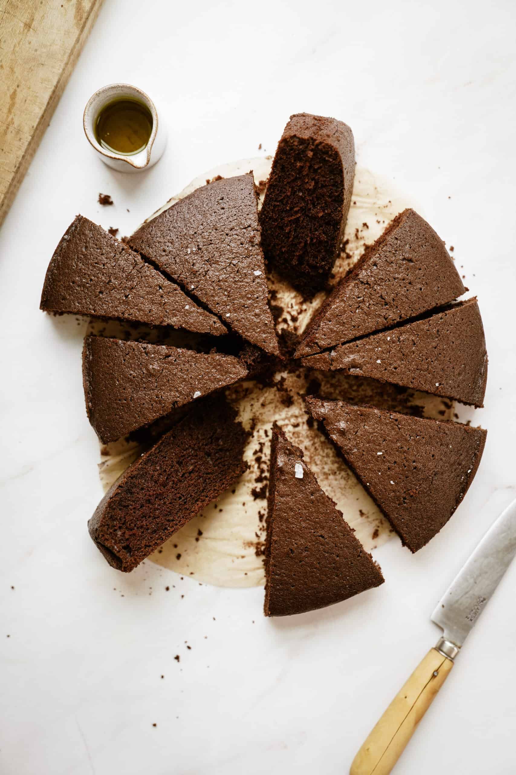 Chocolate Olive Oil Cake sliced into pieces on a countertop