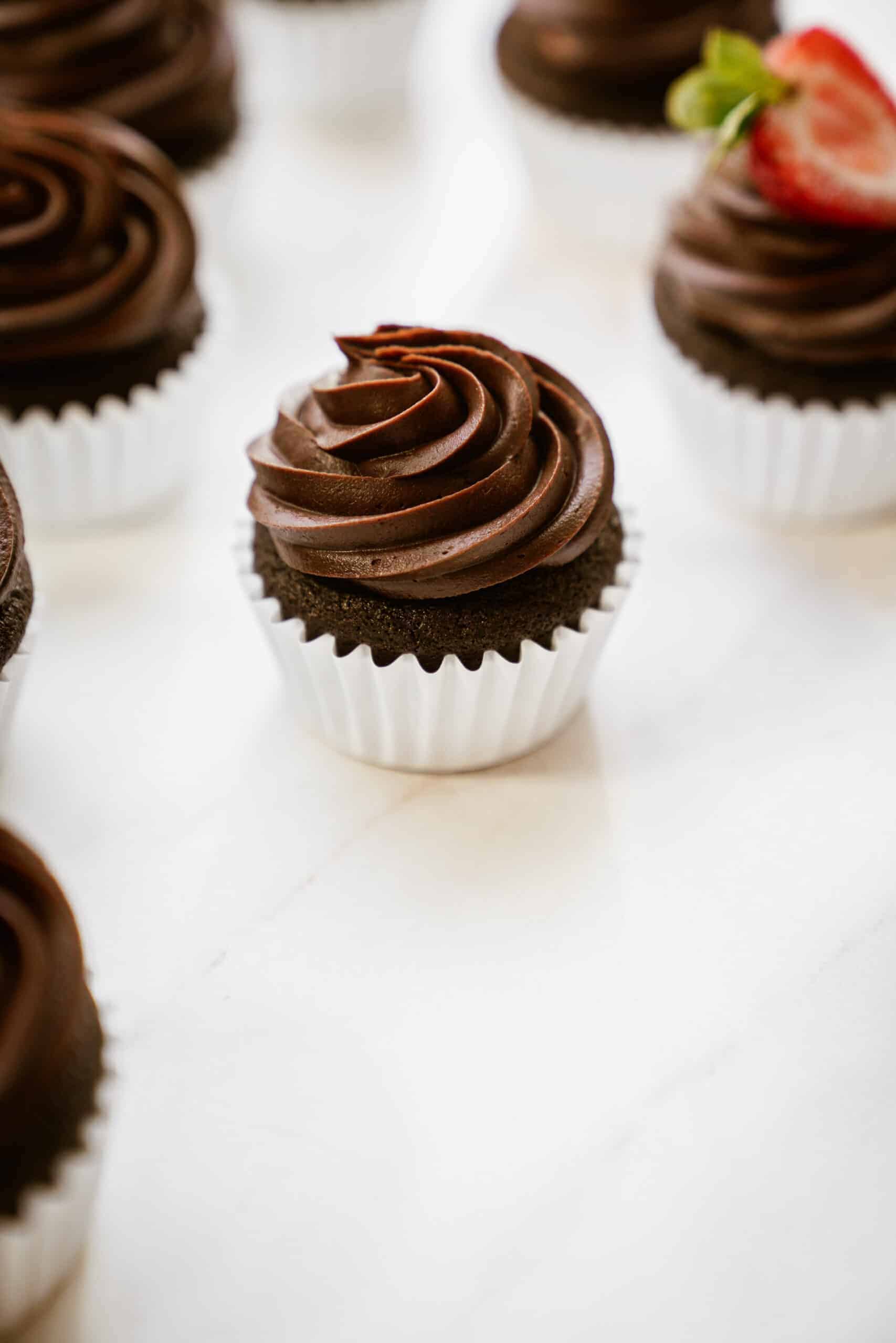 Gluten-free chocolate cupcakes on a white counter