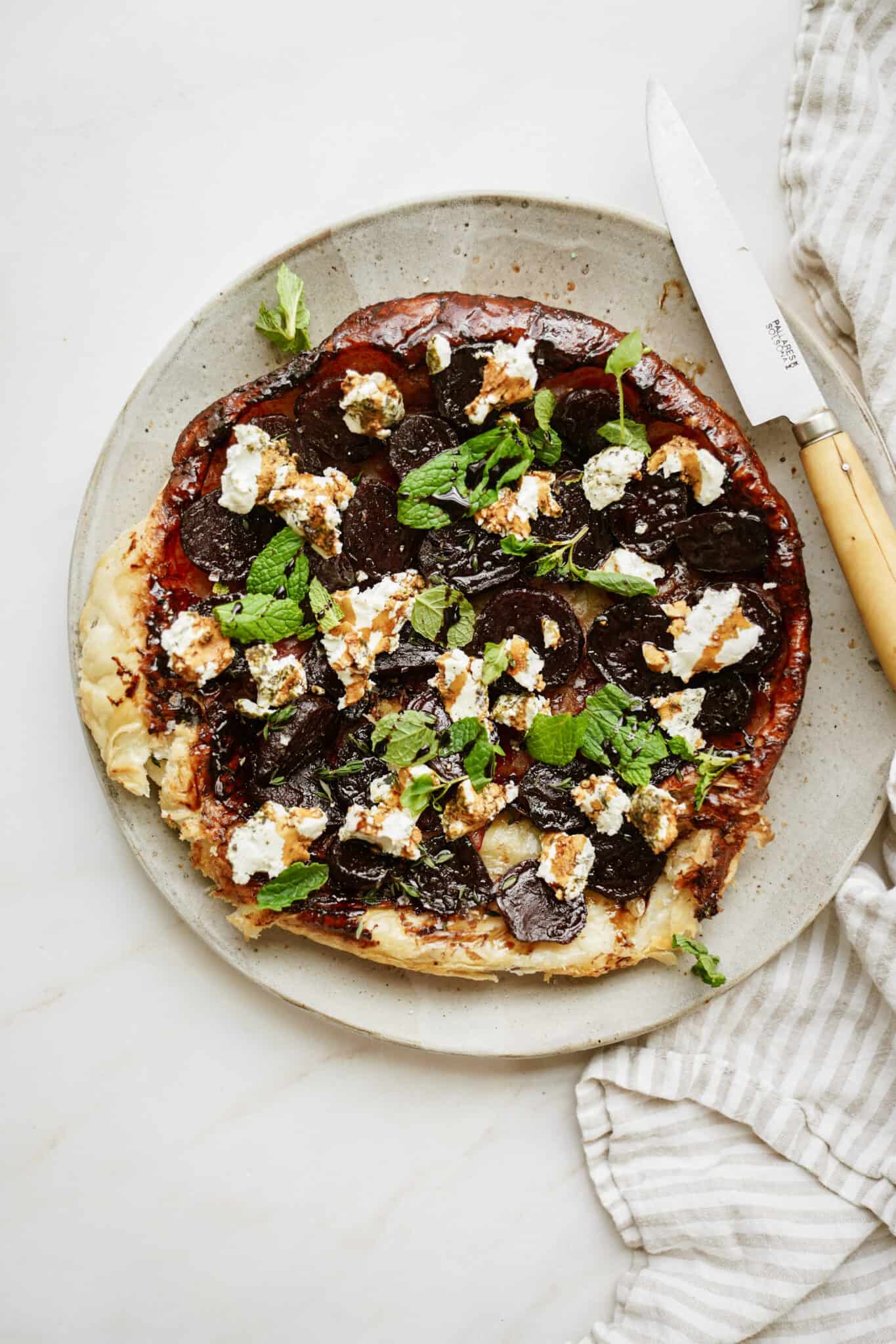 Beet and goat's cheese tart on a plate