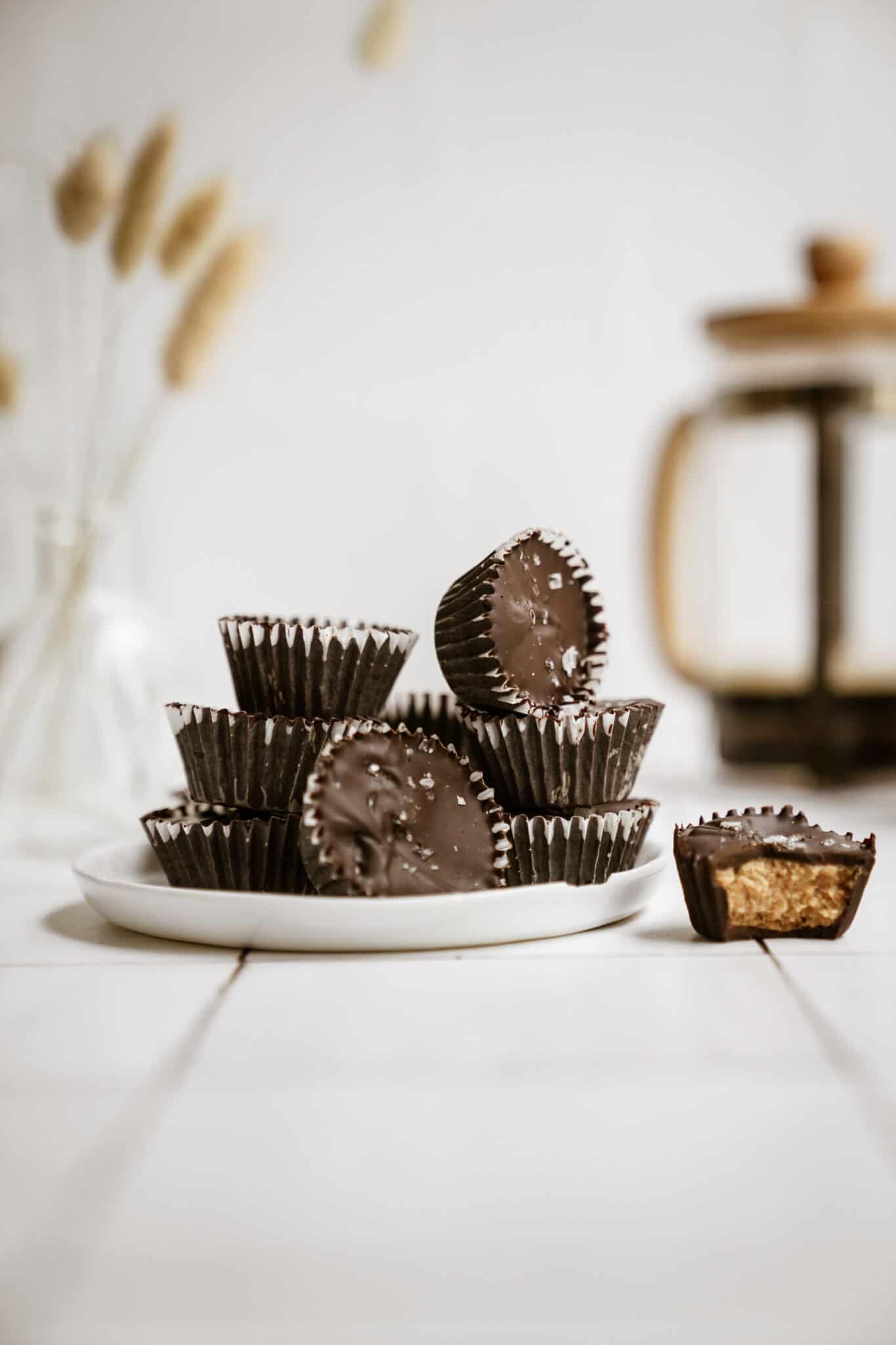 Homemade Peanut Butter Cups stacked on a plate