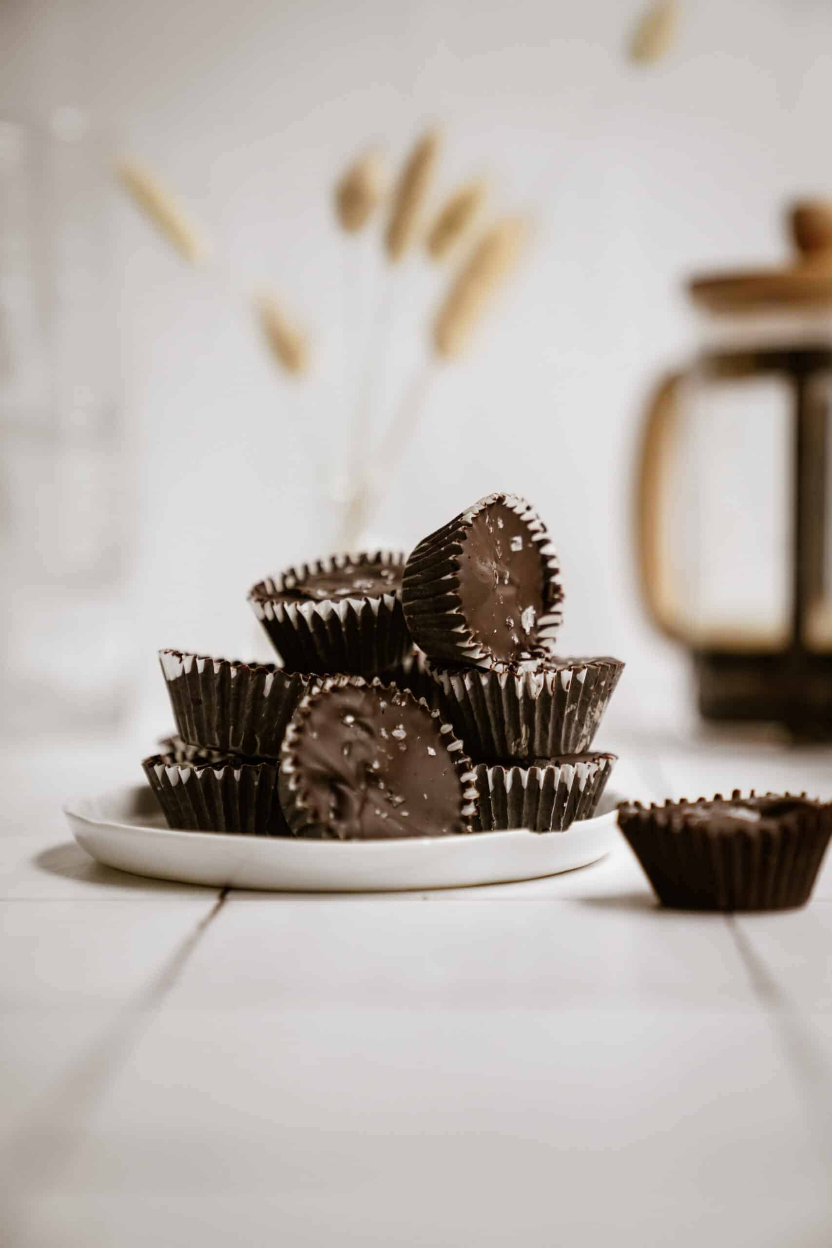 Homemade Peanut Butter Cups stacked on a plate