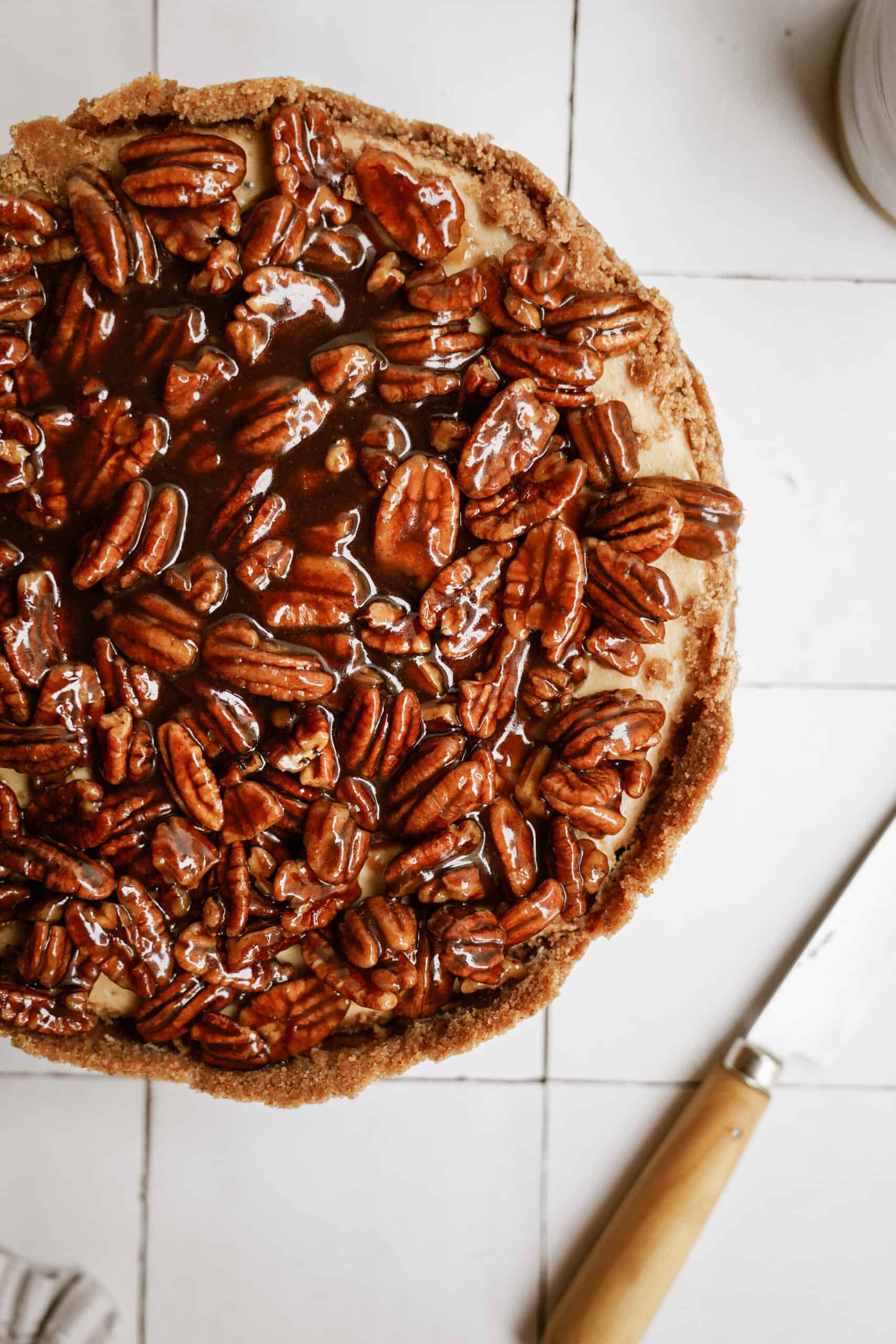 Pecan pie cheesecake on a counter