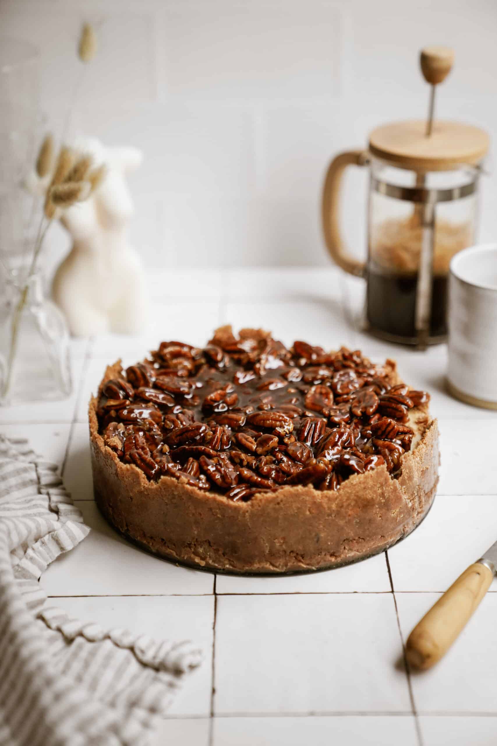 Pecan pie cheesecake recipe on a counter