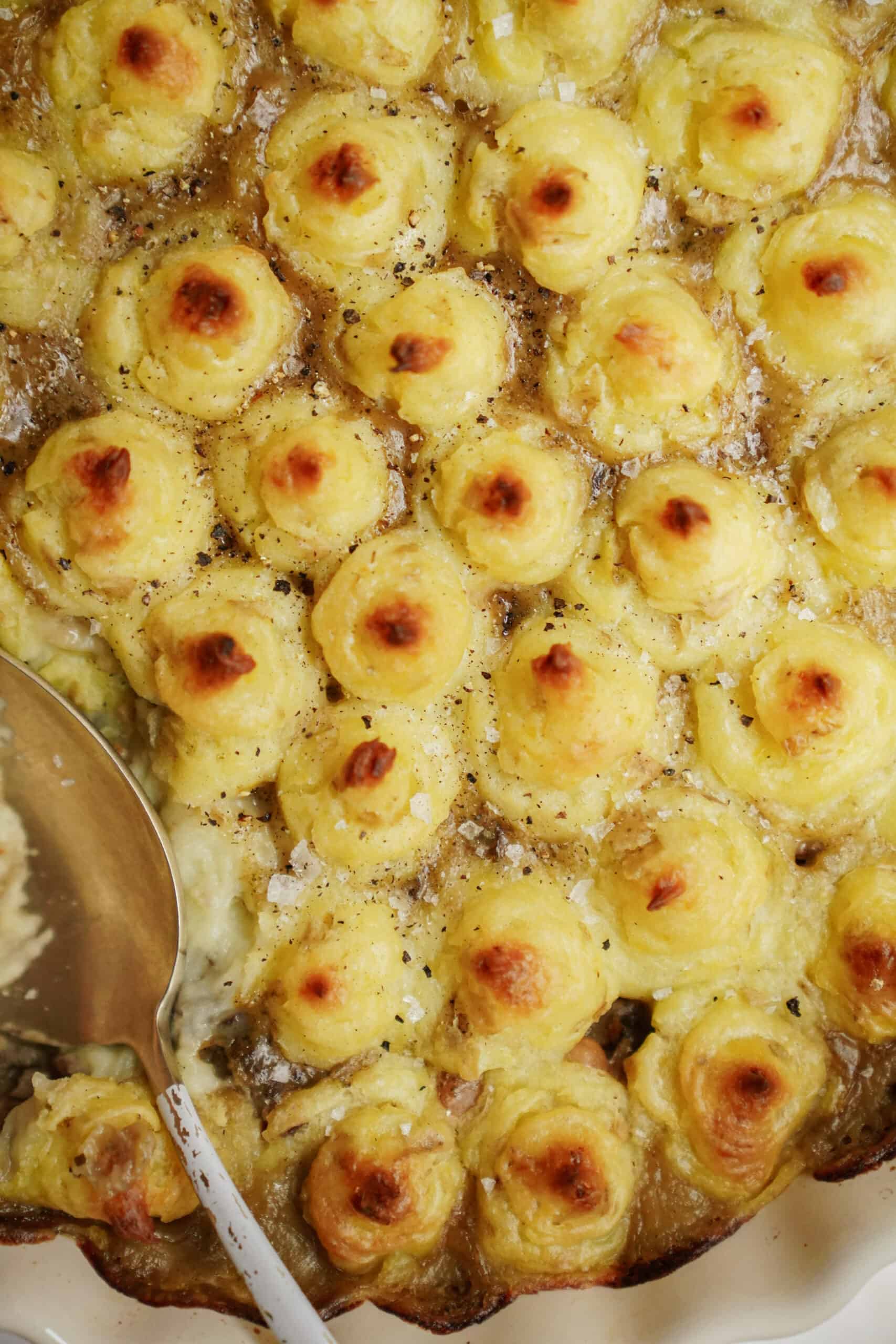 White Bean Shepherd's Pie in a casserole dish with a spoon