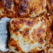 Slice of zucchini lasagna recipe being picked up with a spatula