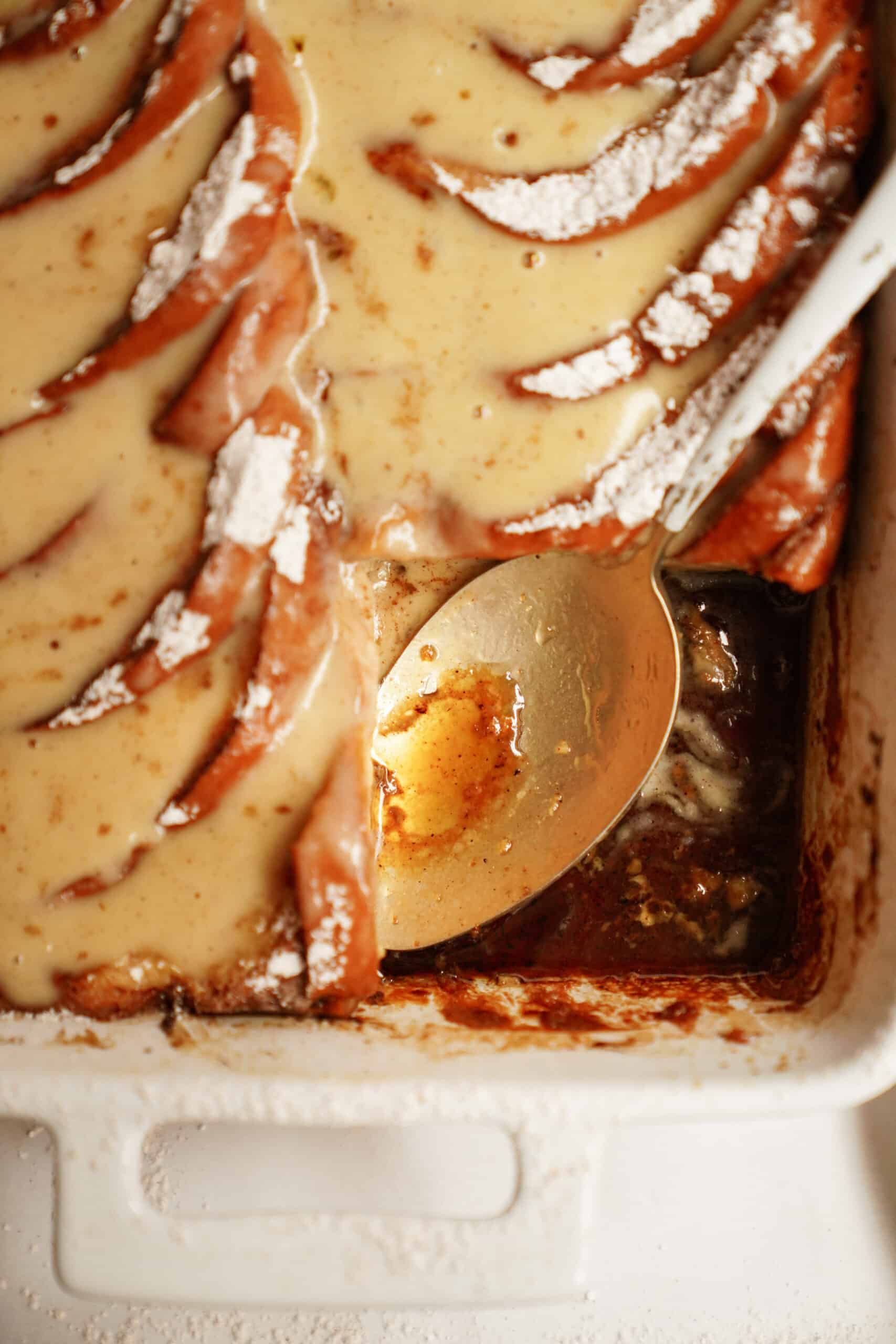 Close-up of Baked French Toast Recipe with a spoon taking a piece out