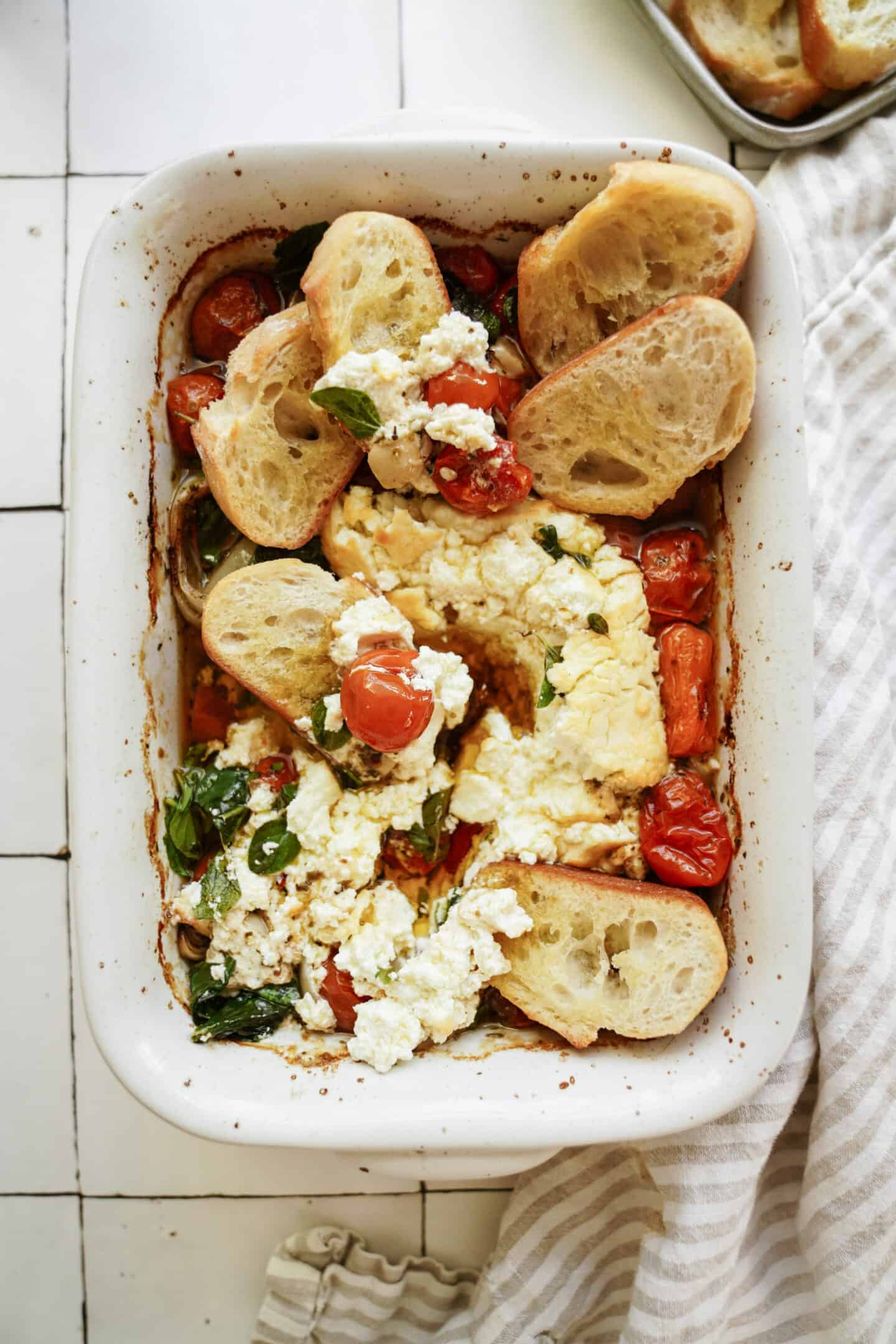 Baked goat cheese dip in a casserole dish