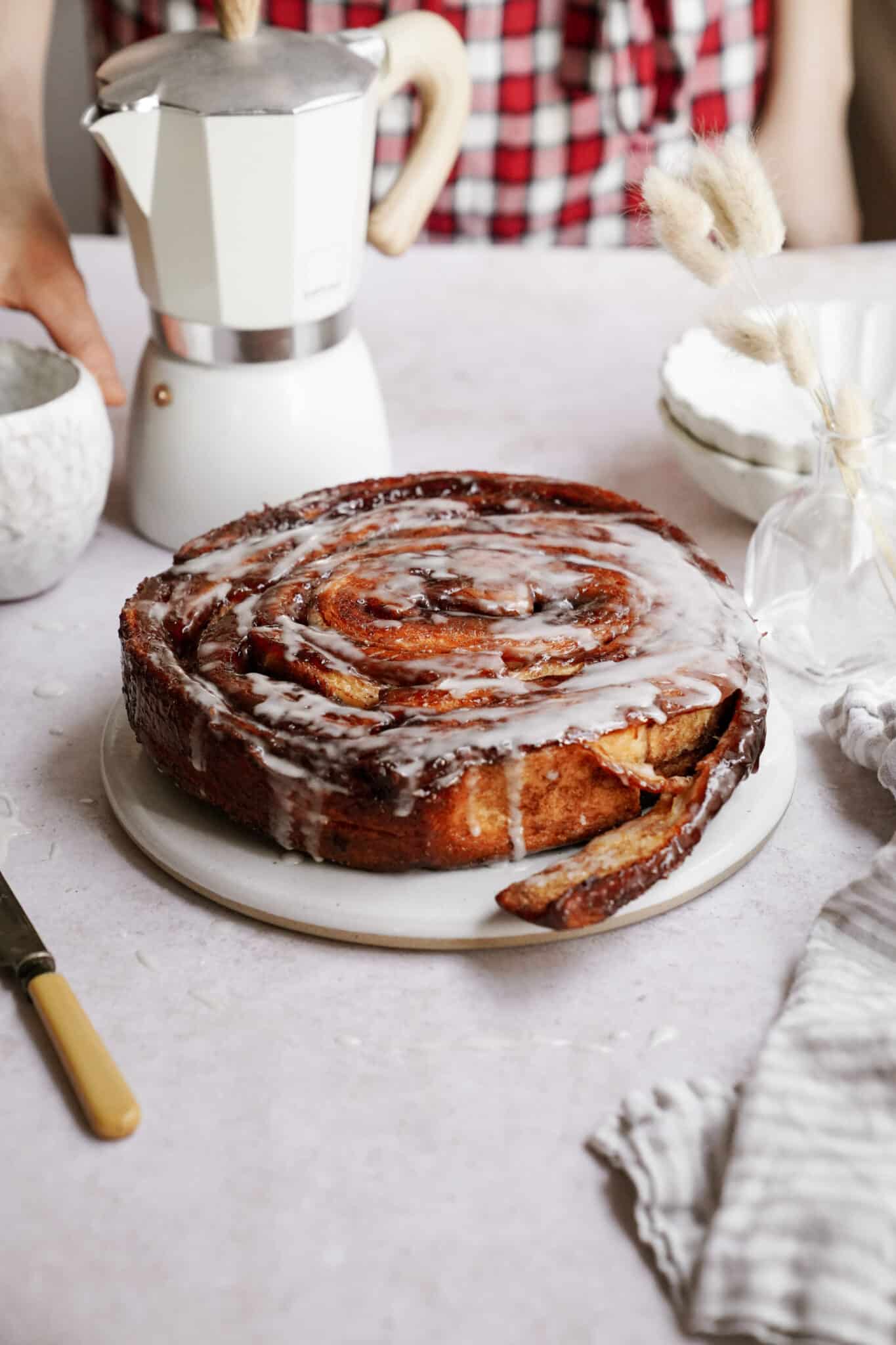 Giant cinnamon roll sitting on a table