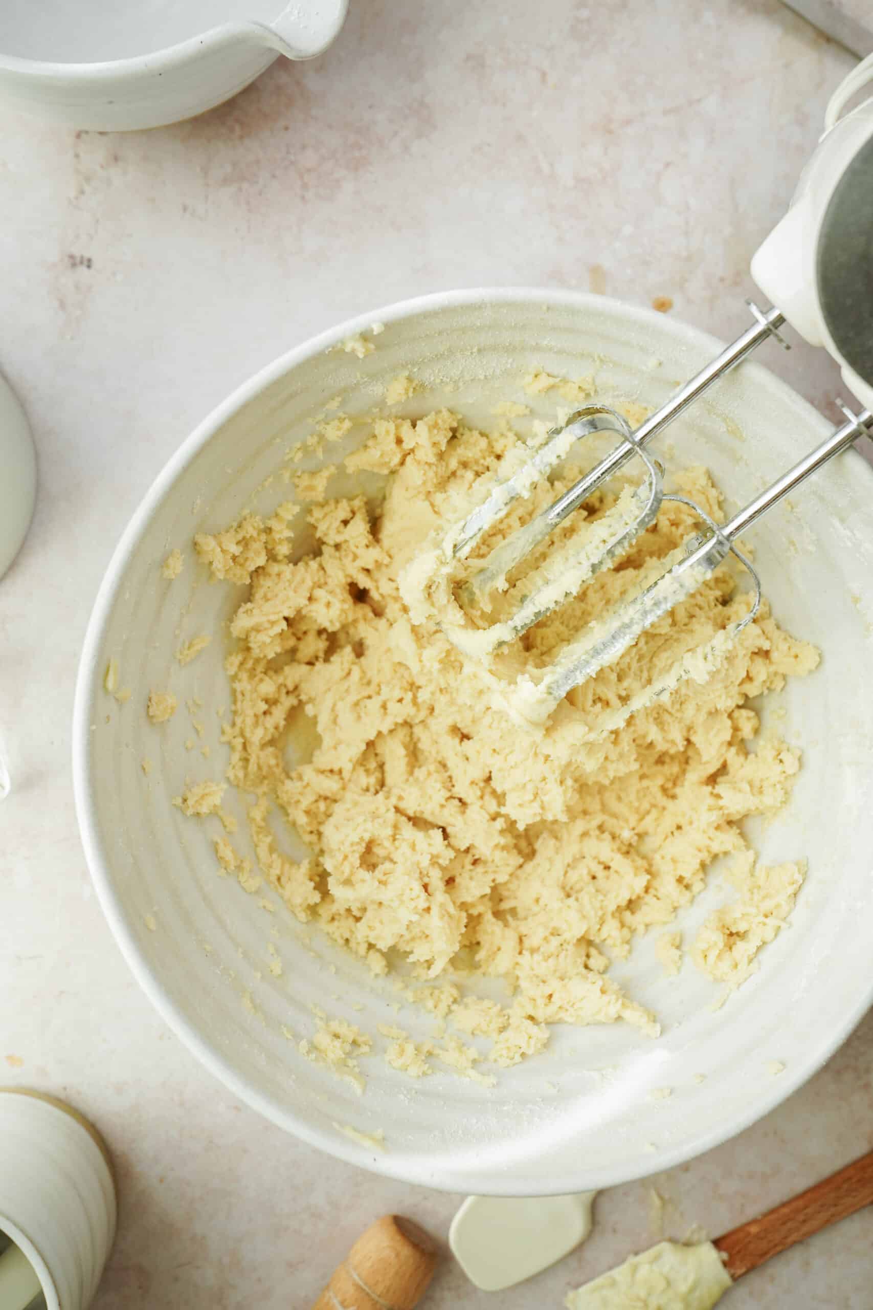 Ingredients beaten in a bowl with an egg beater