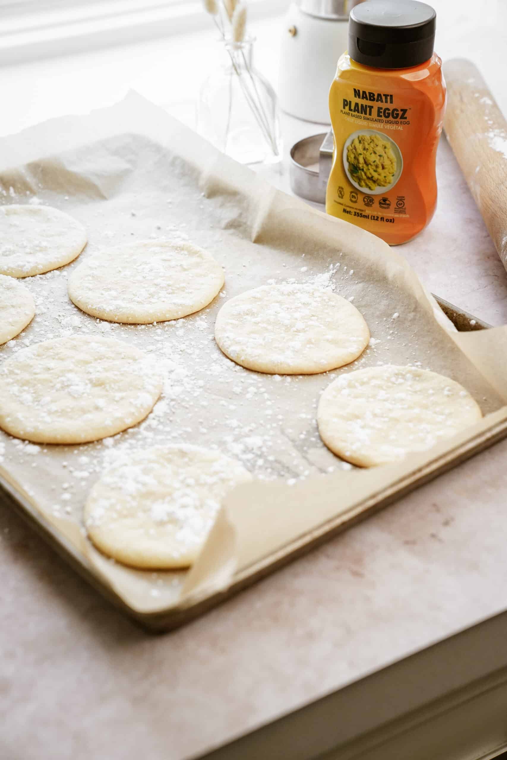 Baking sheet with holiday sugar cookies on it