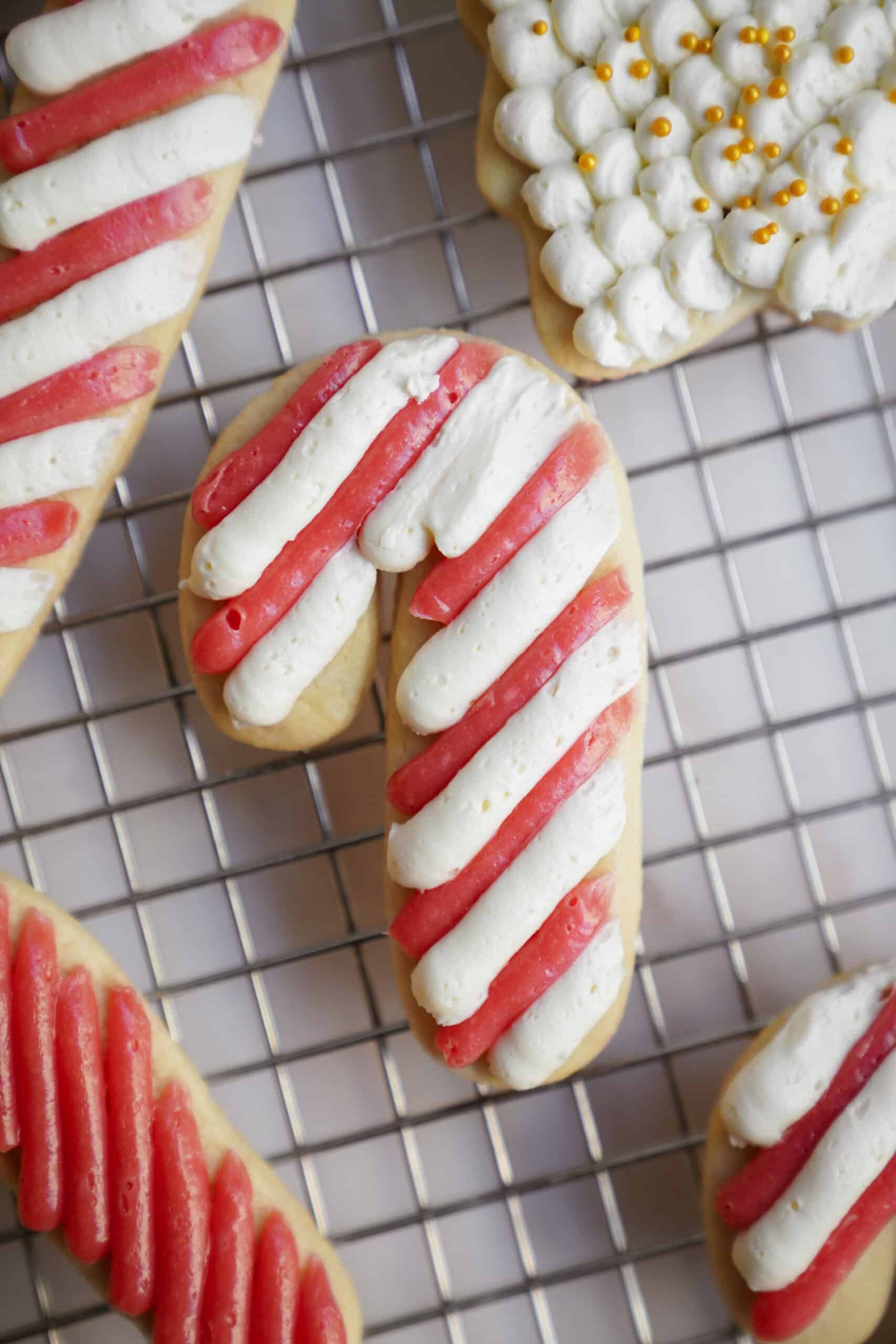 Candy cane sugar cookie on cooling rack 