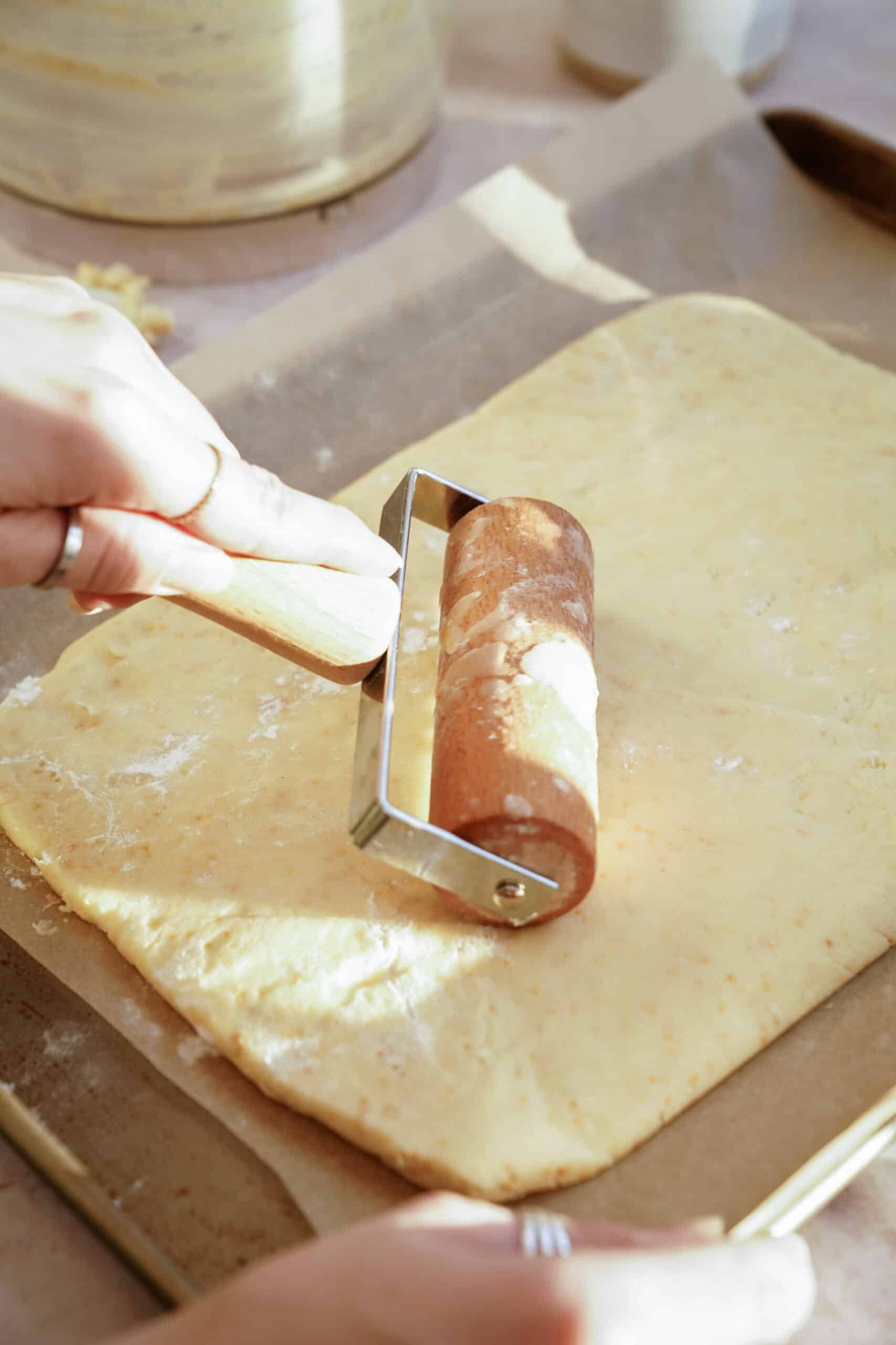 Holiday Shortbread Bites dough being flattened on a counter