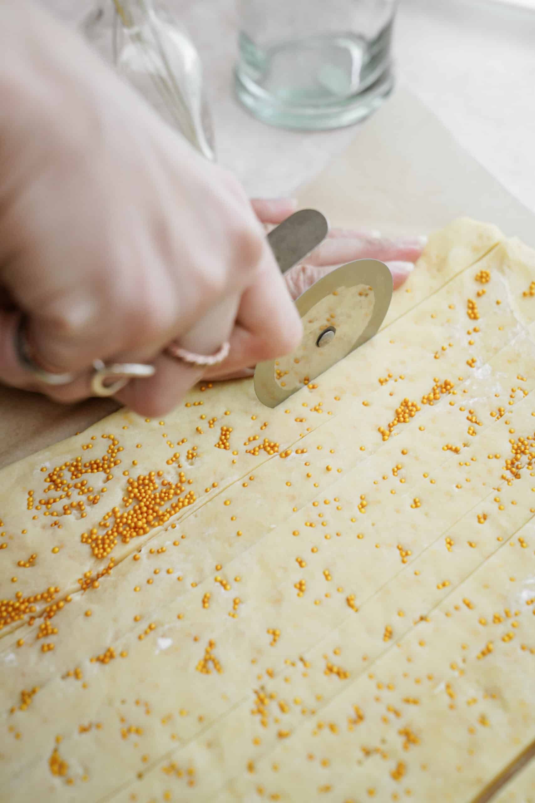 Holiday Shortbread Bites being cut into squares