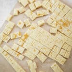 Holiday Shortbread Bites cut into squares on parchmant