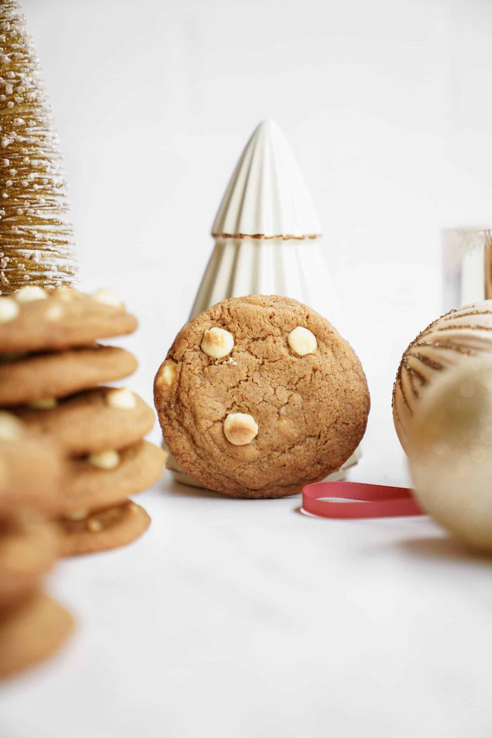 White chocolate chip cookies standing on its side with christmas decor