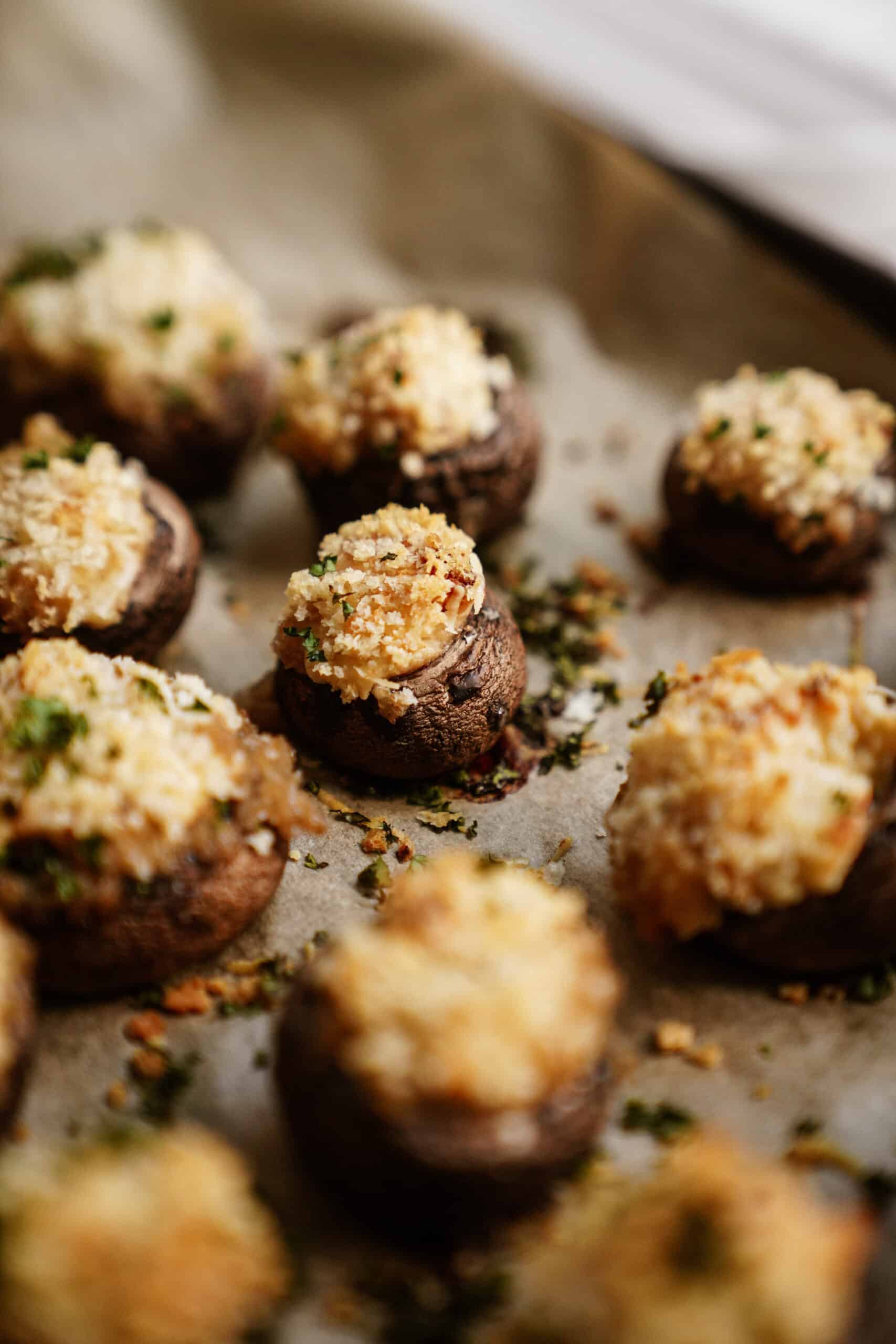 Vegetarian stuffed mushrooms on a baking tray