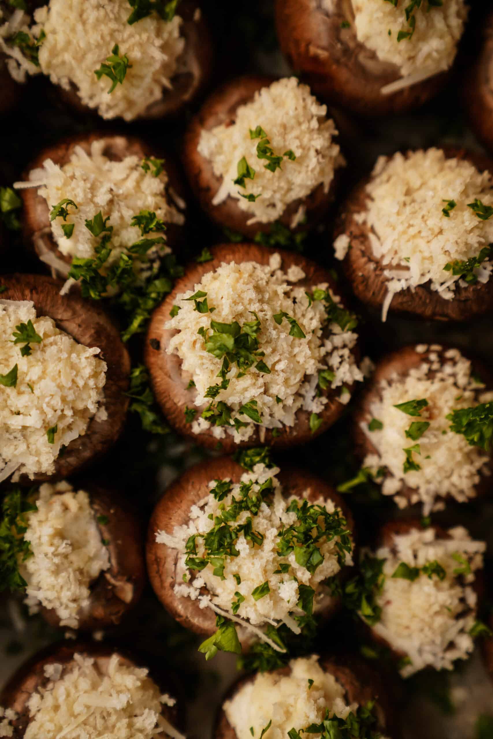 Vegetarian stuffed mushrooms on a baking tray