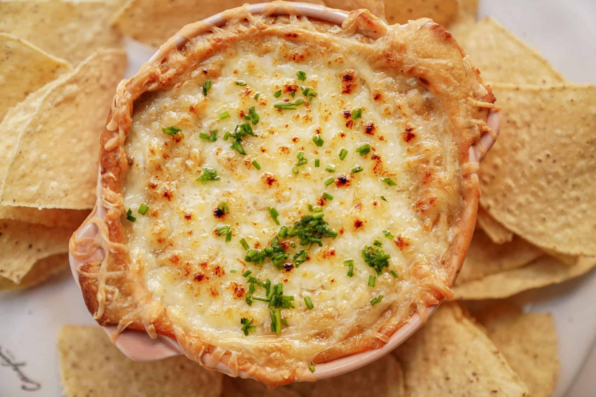 White bean dip surrounded by nacho chips