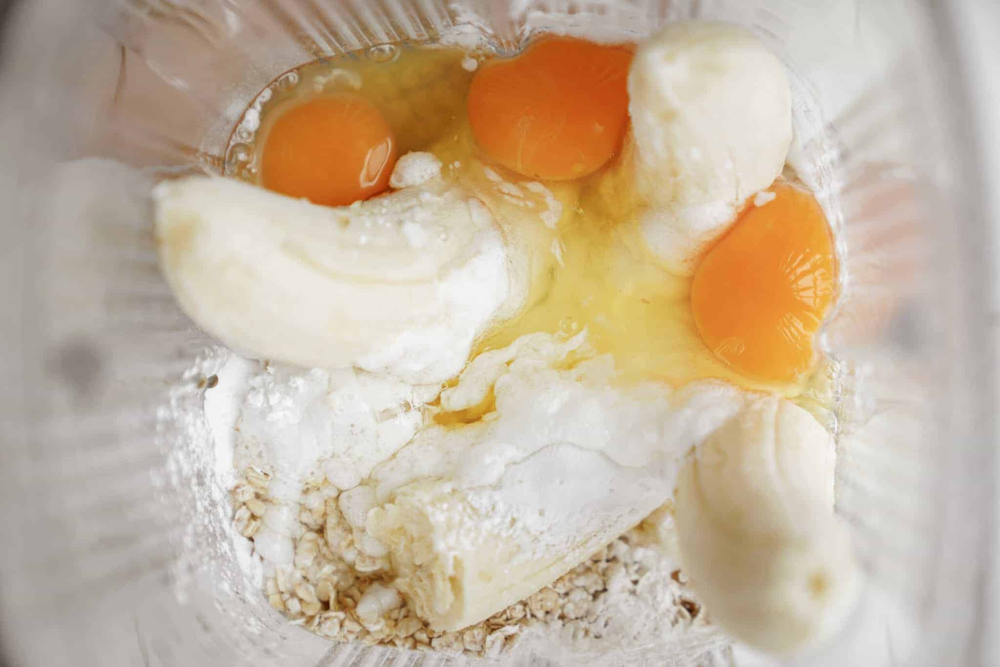 Raw ingredients for baked oats in a blender