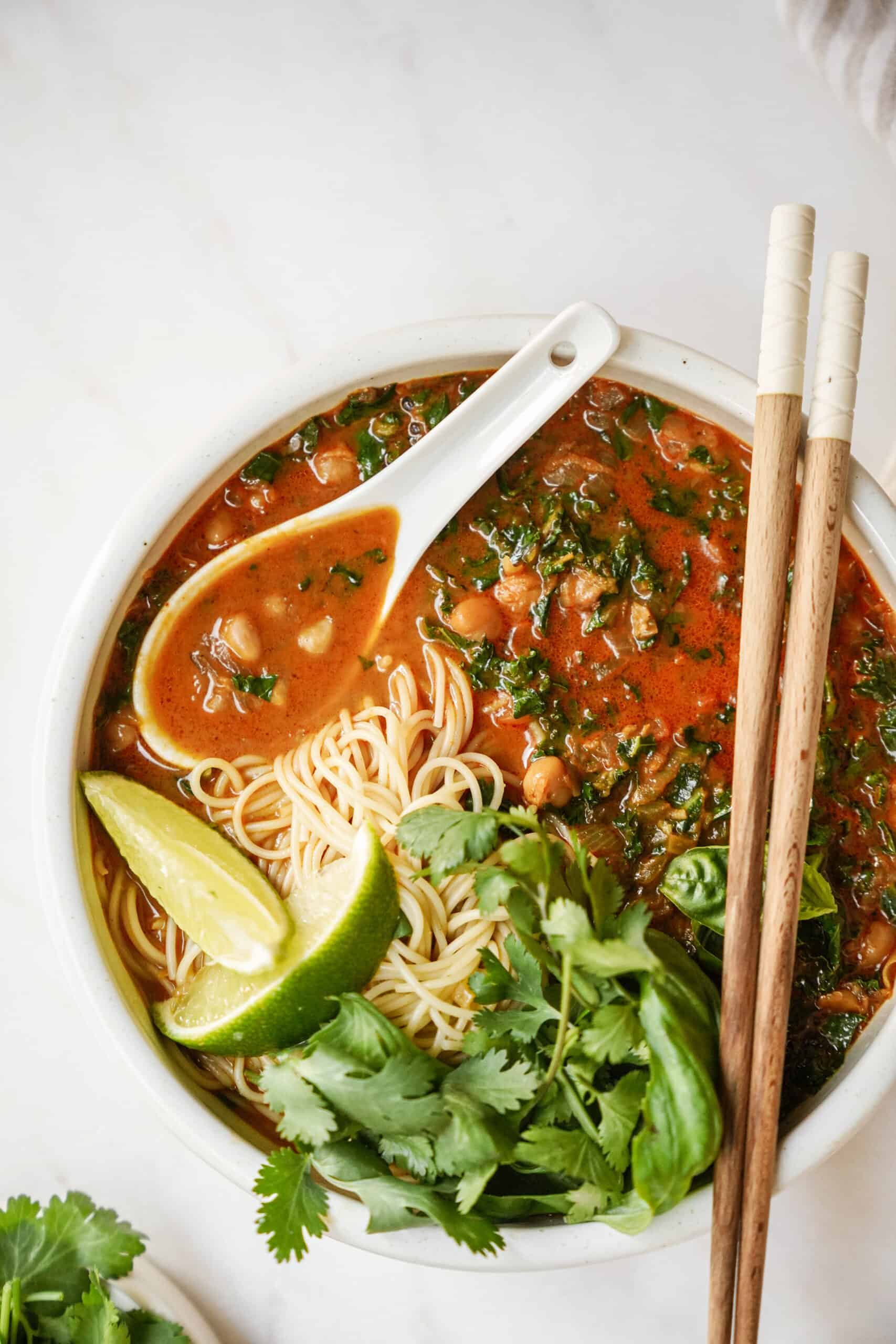 Curry noodle soup in big bowl with chopsticks