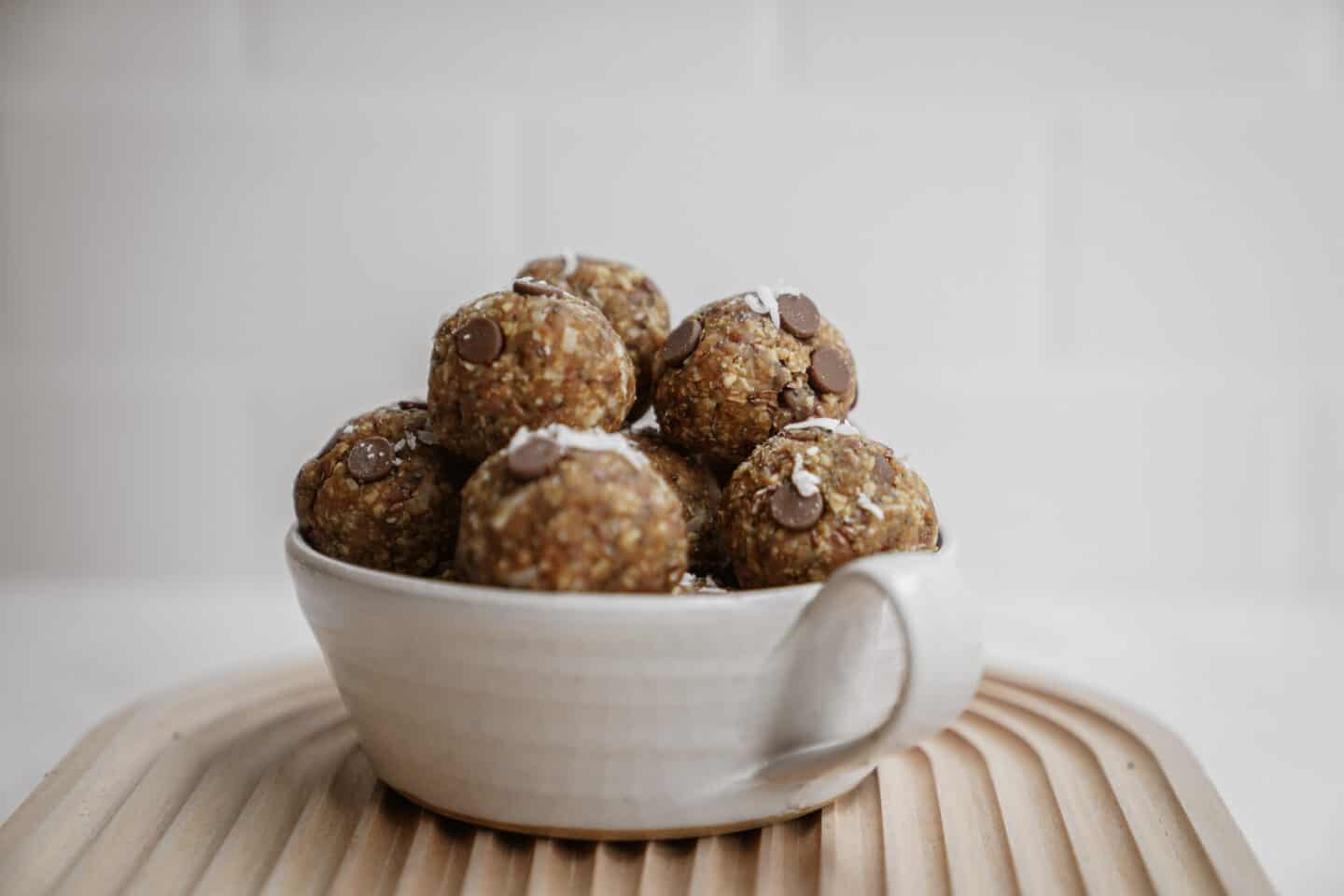 Big bowl of energy bites on cutting board