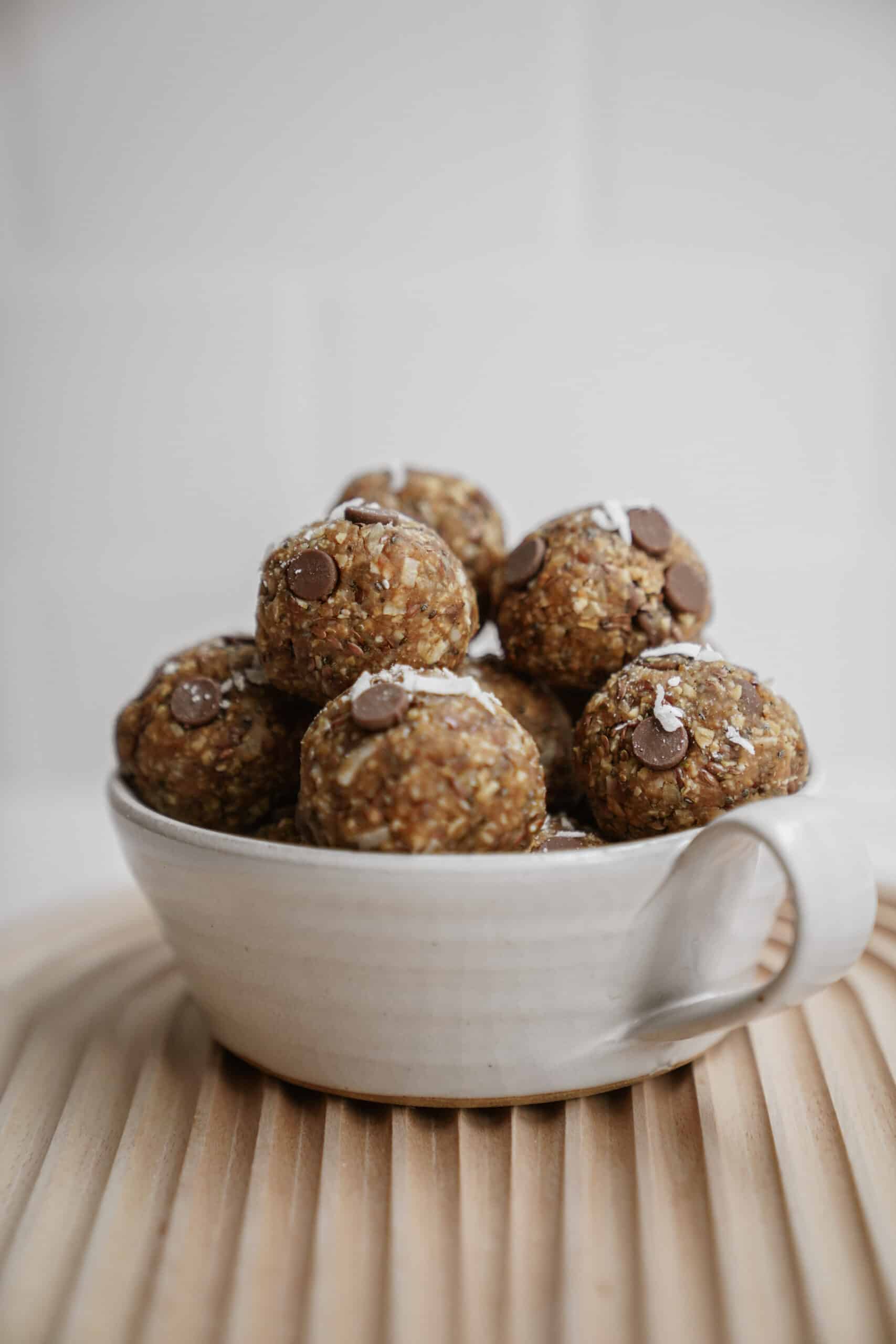 Big bowl of energy bites on cutting board