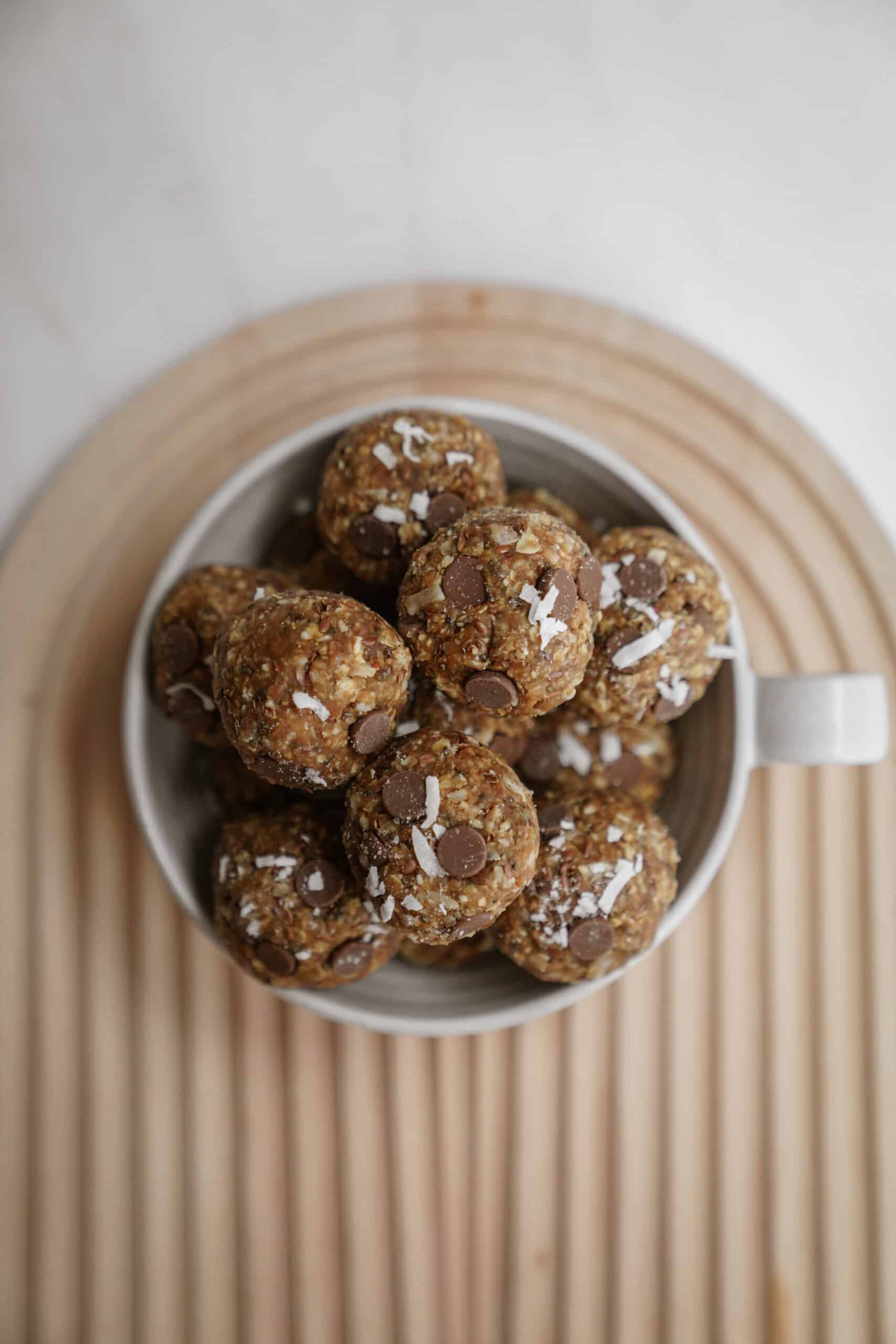 Big bowl of energy bites on cutting board