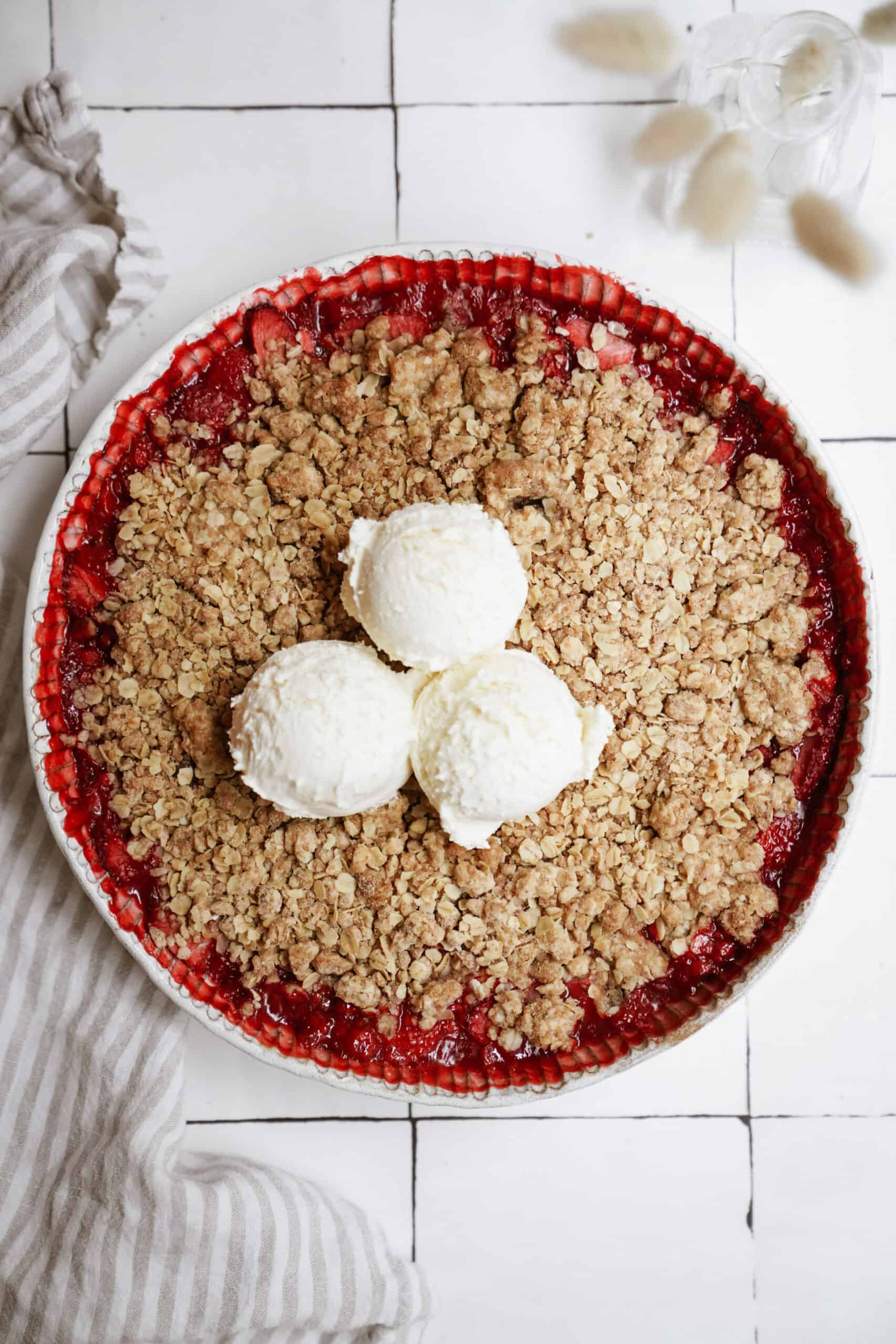 Strawberry crumble with vanilla ice cream on top