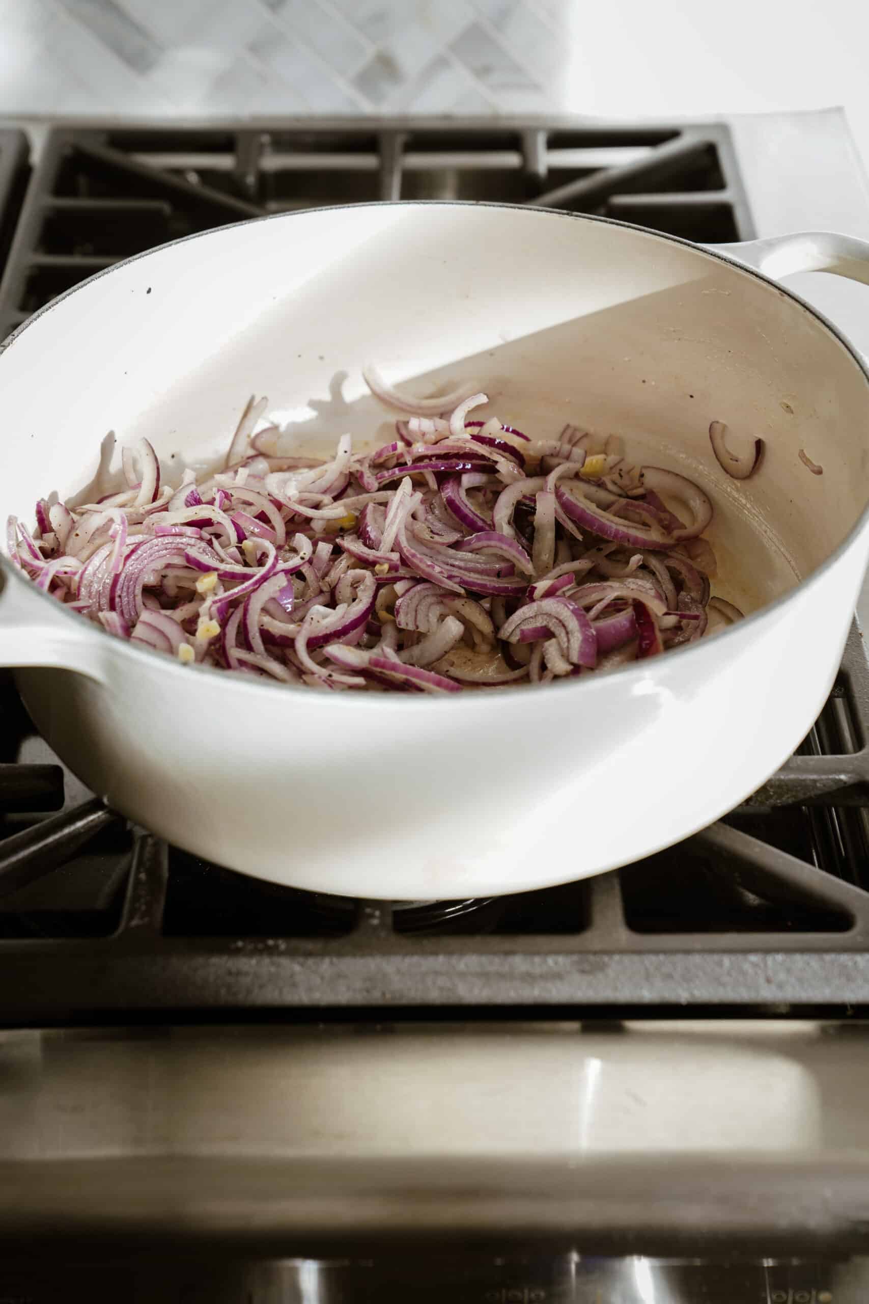Butter and red onions in baking dish