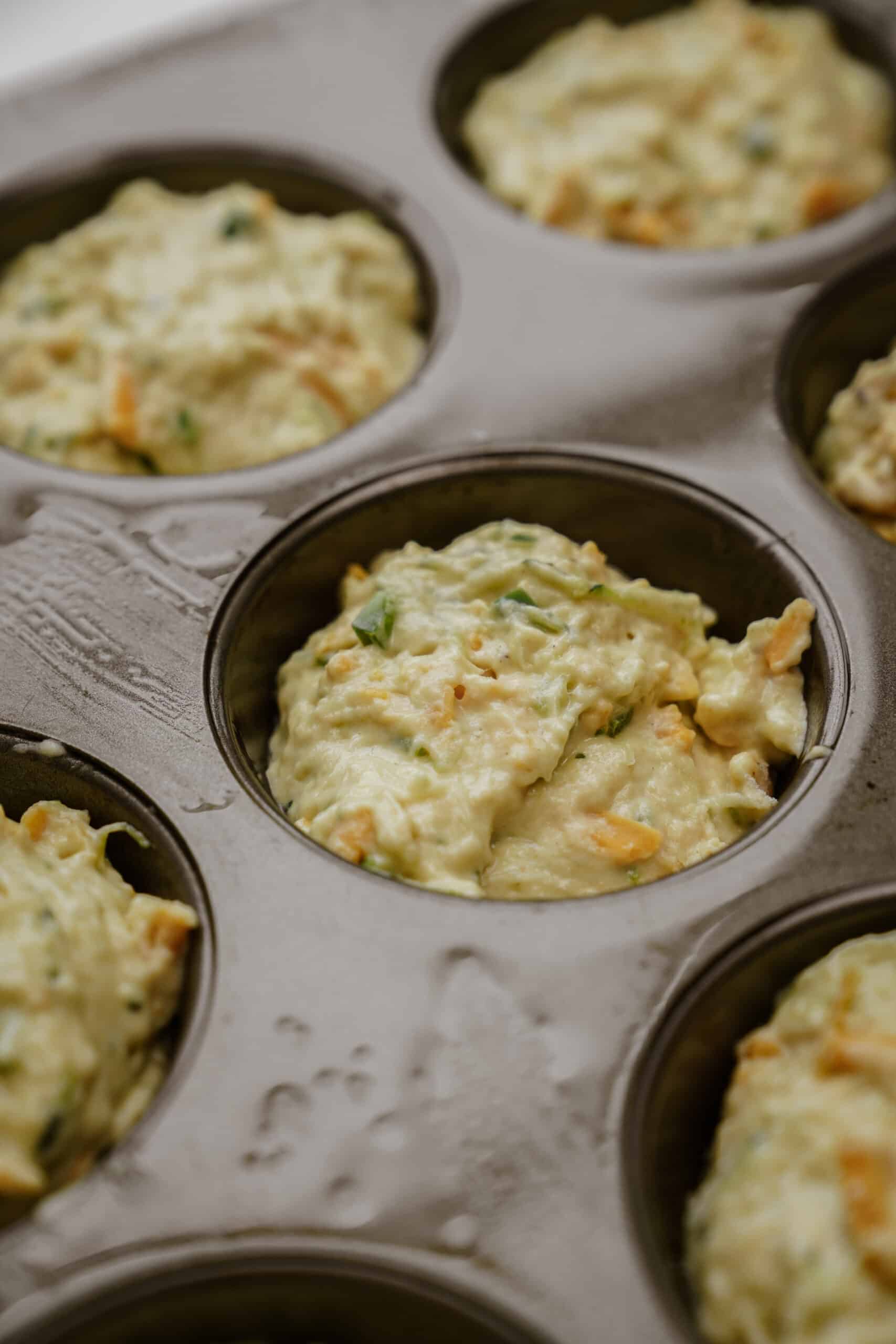 Muffin batter in muffin tin