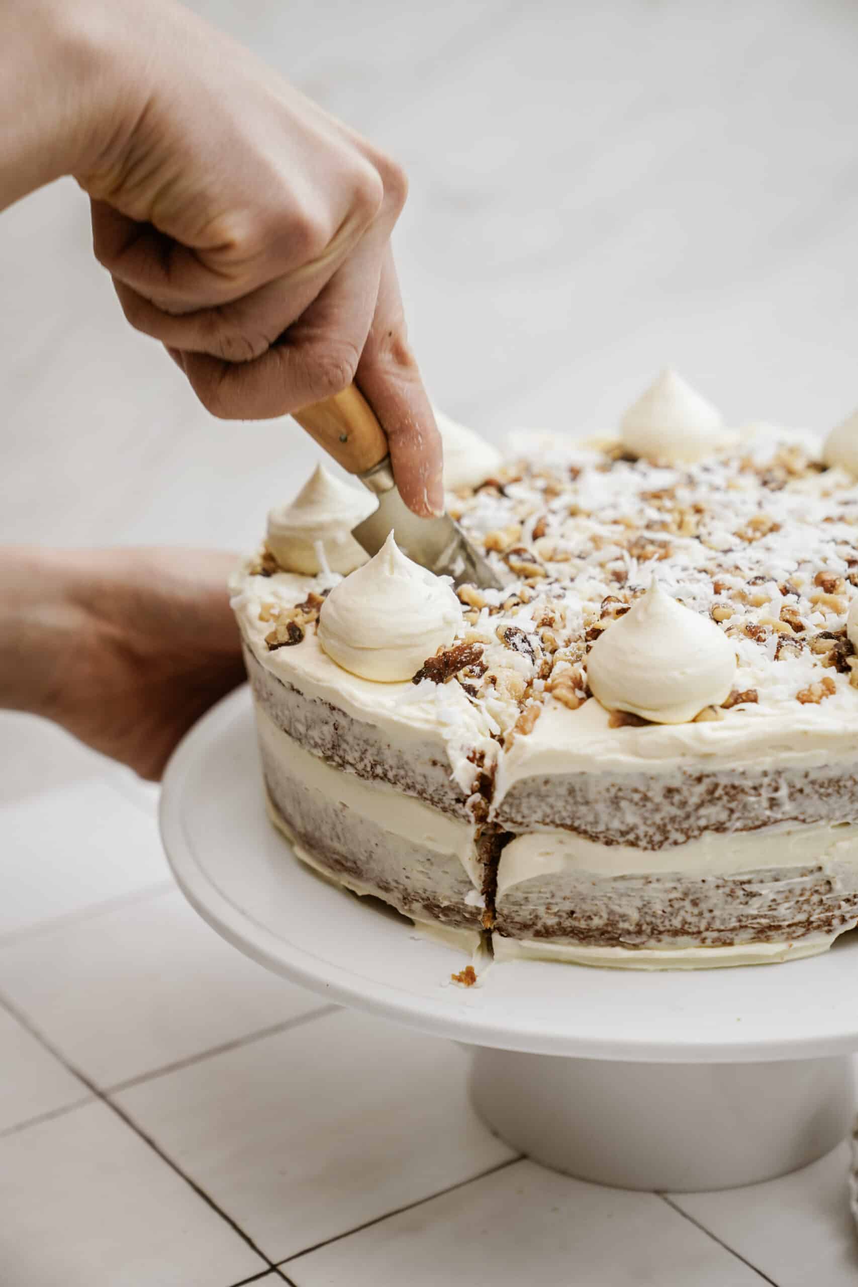 Slicing into carrot cake