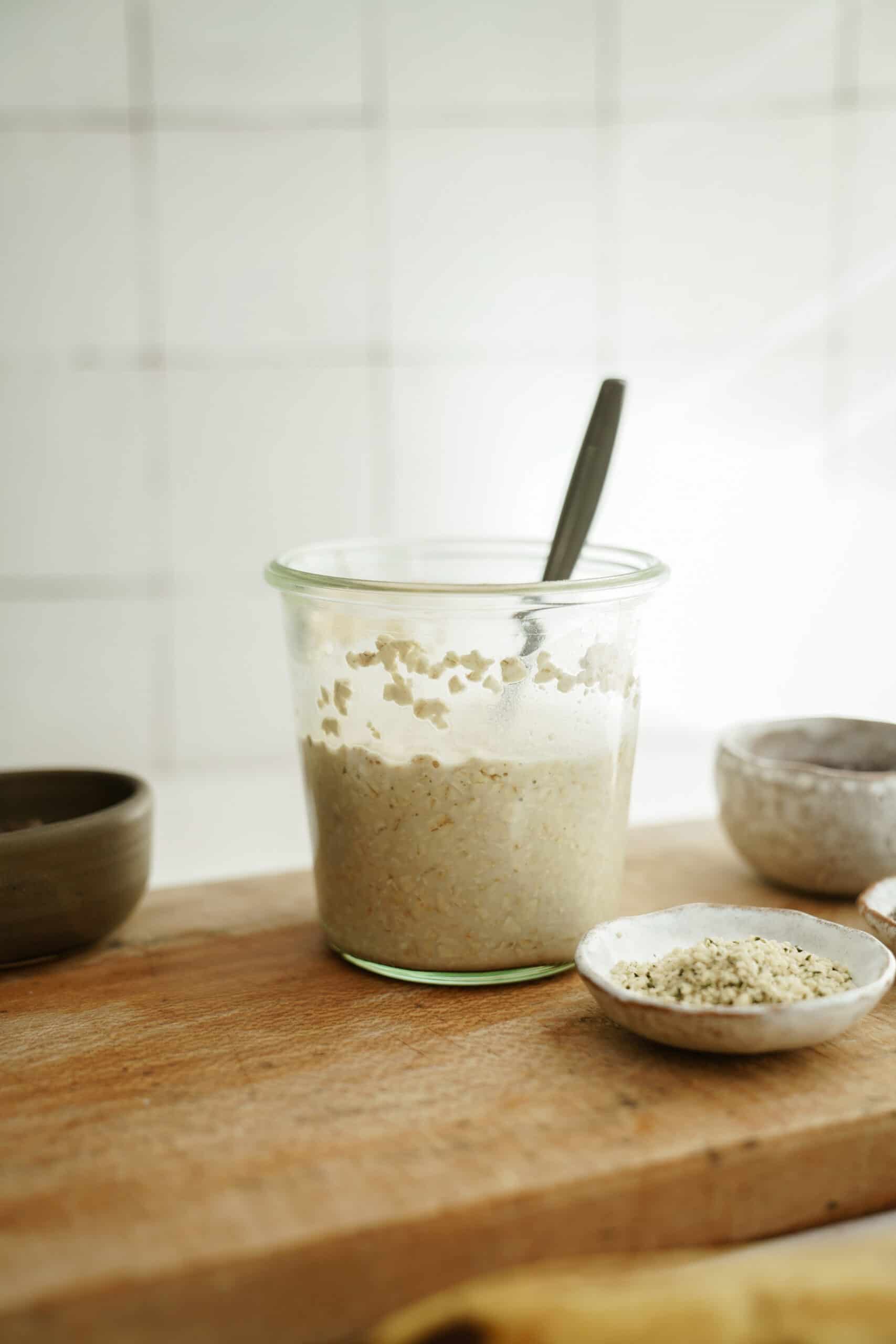 Overnight oats in a jar on a cutting board