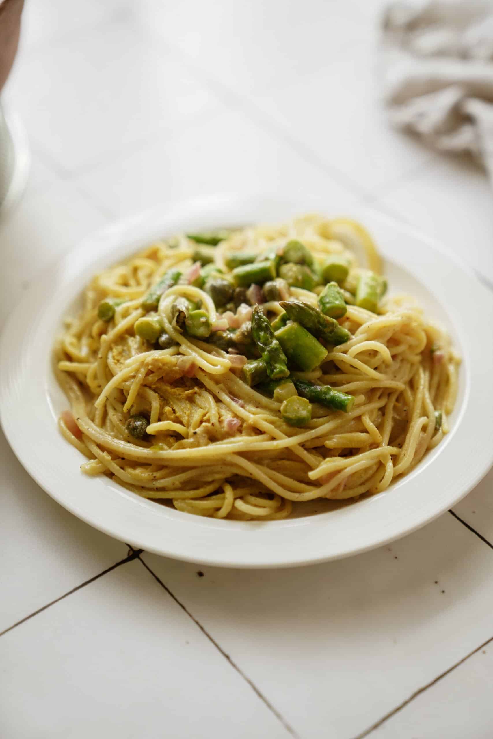 Lemon asparagus pasta on a white plate