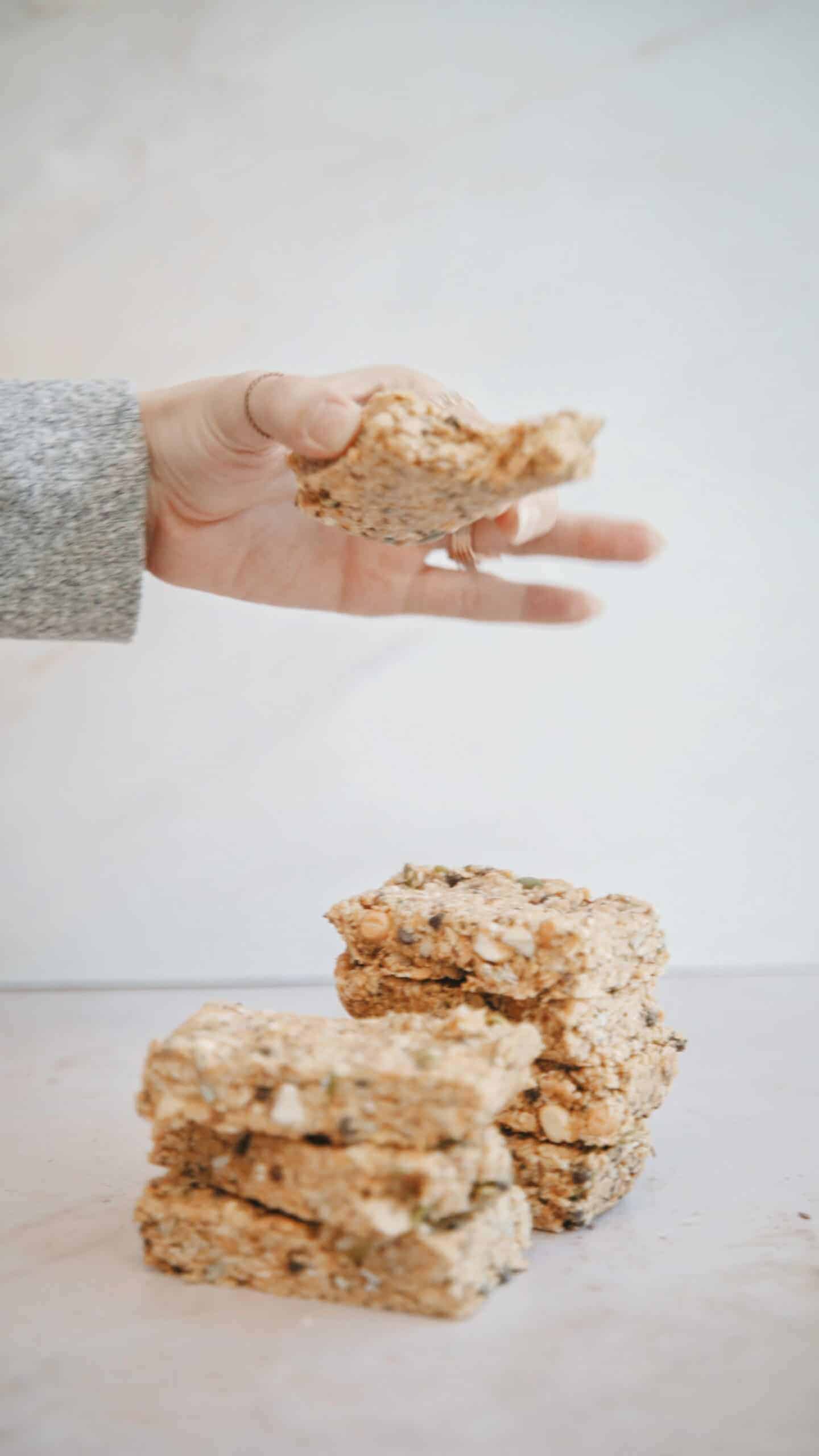 Hand holding no-bake granola bars